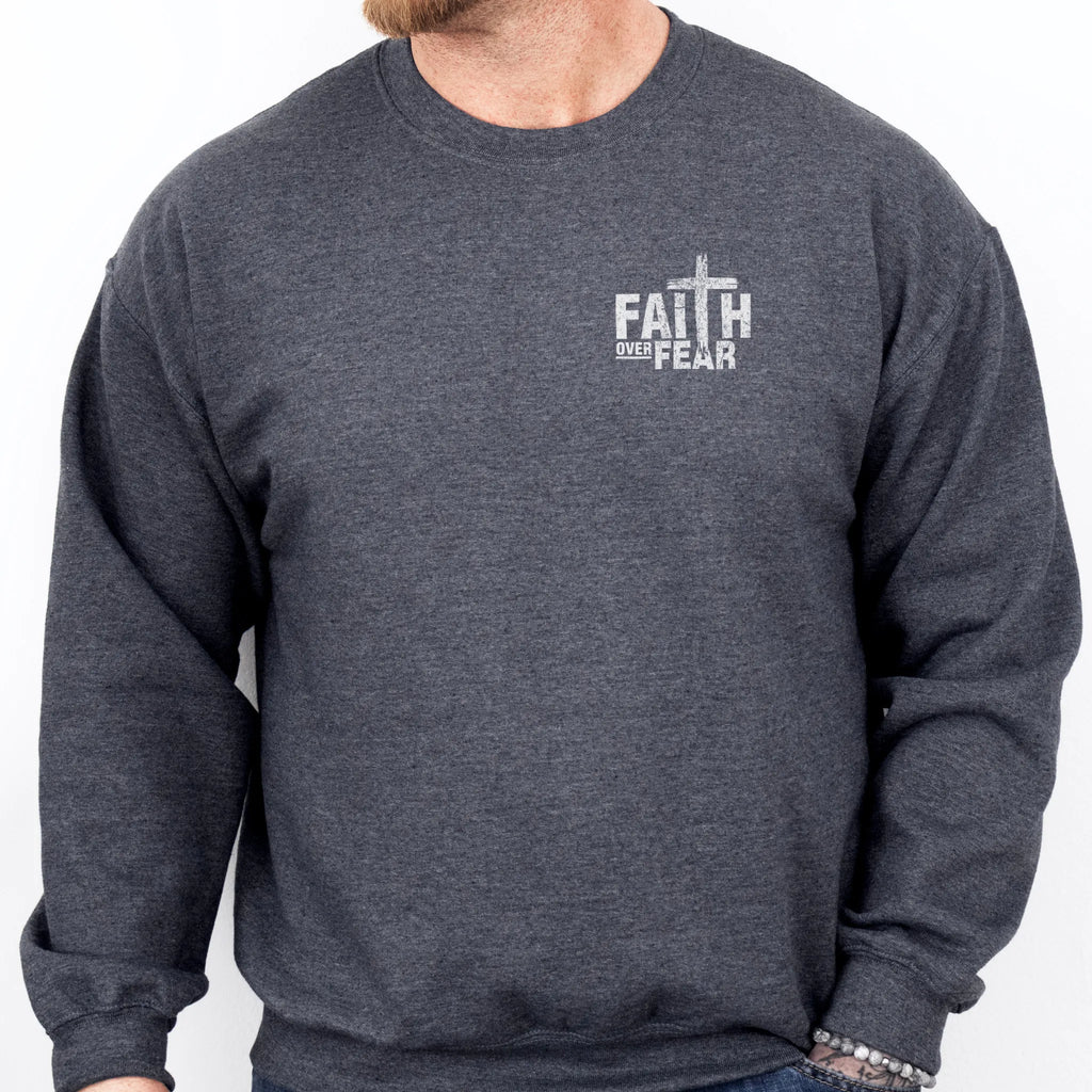 Dark Heather Oakley June sweatshirt, mens fit, left chest badge reads Faith Over Fear with cross, studio front view