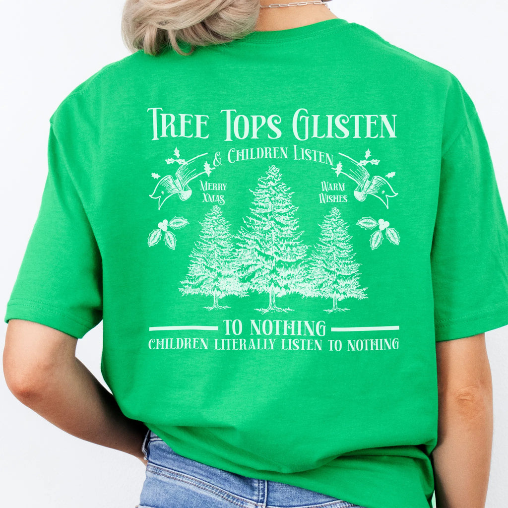 Irish Green Oakley June tee large back print Tree Tops Glisten and Children Listen to Nothing with three evergreen trees, doves, and holly