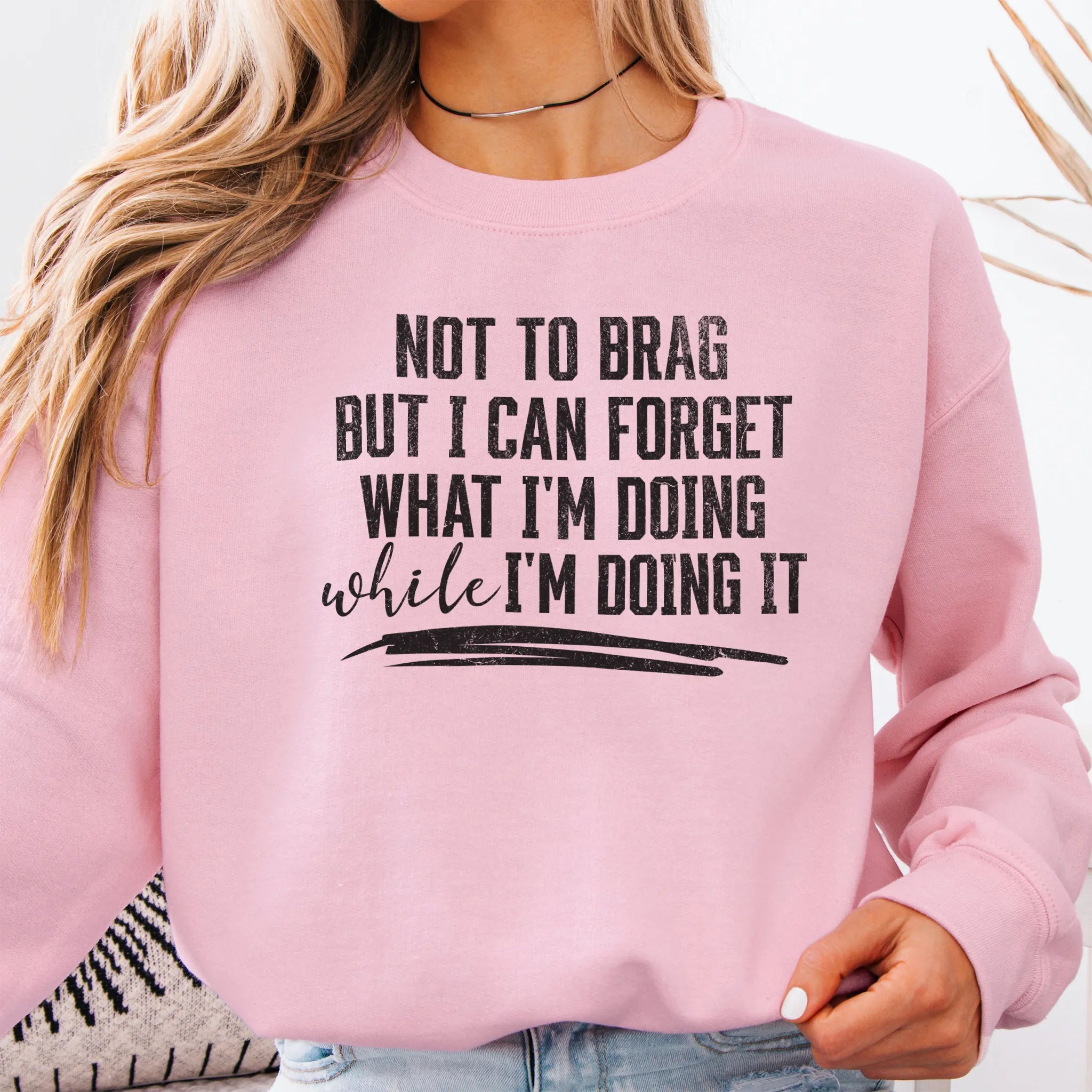 Light Pink Oakley June Sweatshirt front view large text Not To Brag But I Can Forget What I’m Doing While I’m Doing It underline distressed print