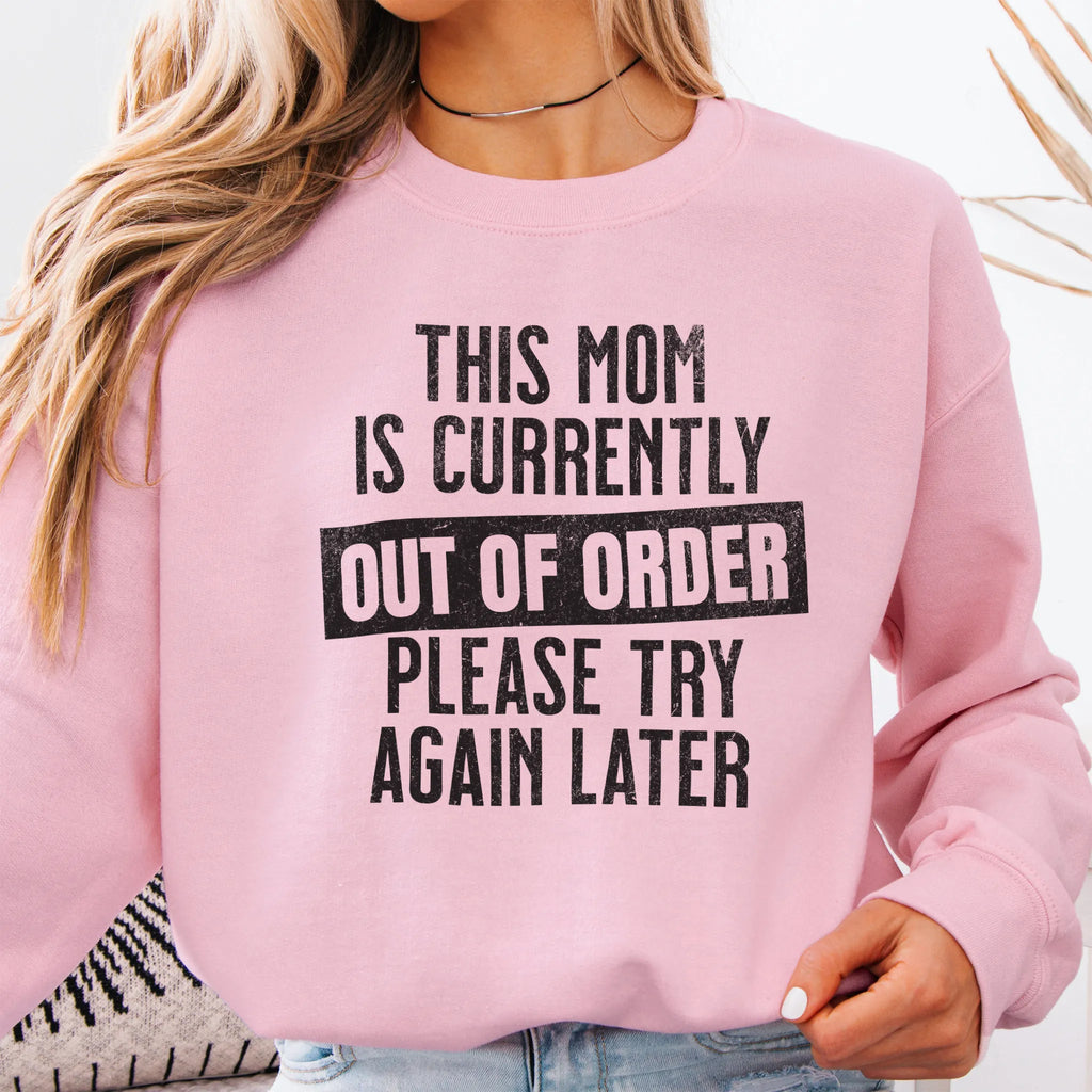 Light Pink sweatshirt – large front text reads “This Mom Is Currently Out of Order, Please Try Again Later”, relaxed modern fit, cropped to torso, studio front view