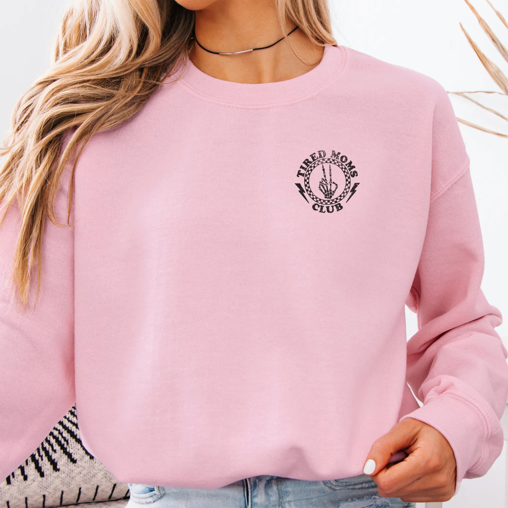  Light Pink Oakley June Sweatshirt front view small left chest Tired Moms Club badge crest distressed print