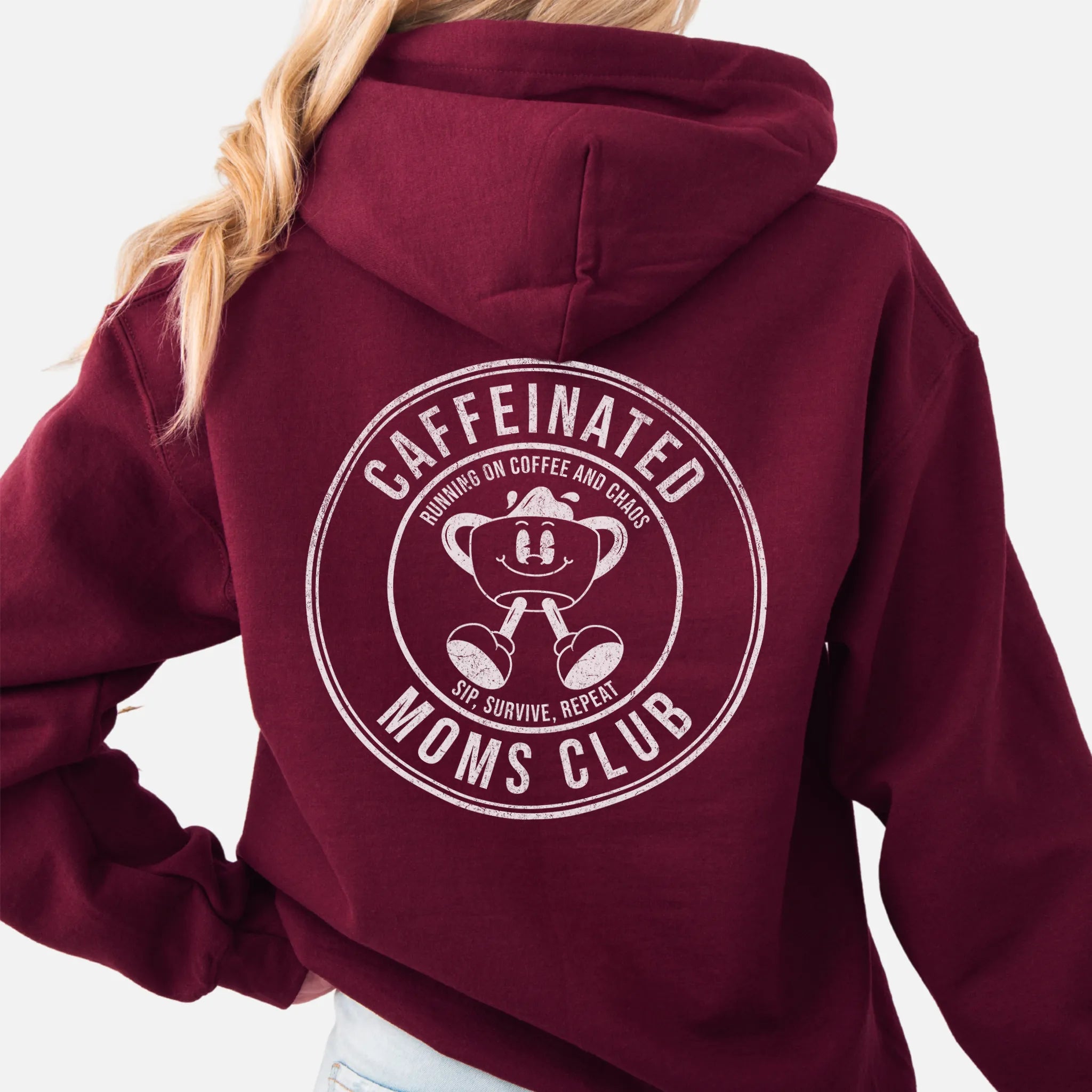 Maroon Oakley June Hoodie back view Caffeinated Moms Club large circle badge coffee cup mascot text Running on Coffee and Chaos Sip Survive Repeat distressed print