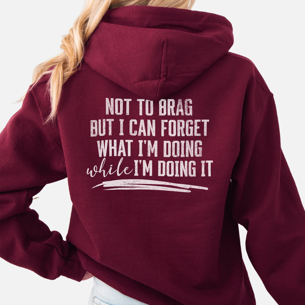 Maroon Oakley June Hoodie back view large text Not To Brag But I Can Forget What I’m Doing While I’m Doing It underline distressed print