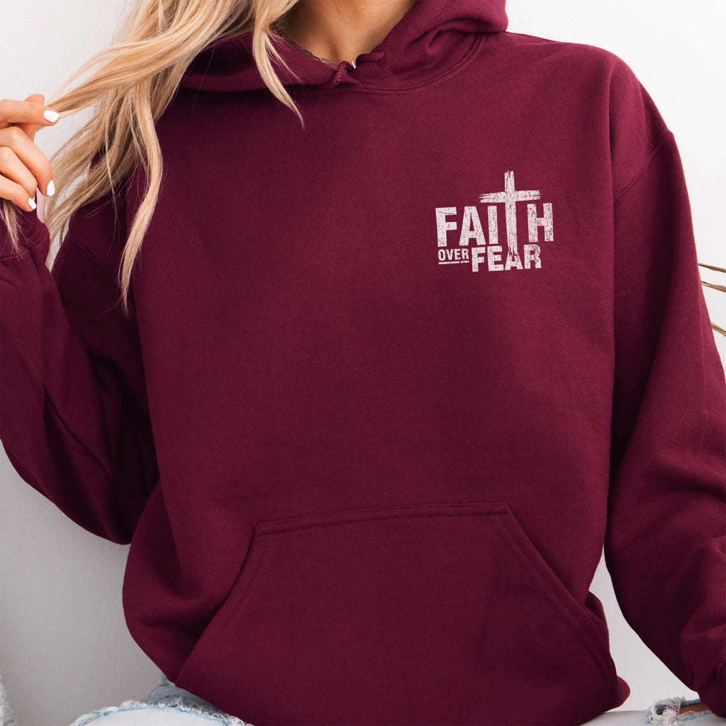 Maroon Oakley June hoodie, left chest badge reads Faith Over Fear with small cross, kangaroo pocket and relaxed modern fit, studio front view