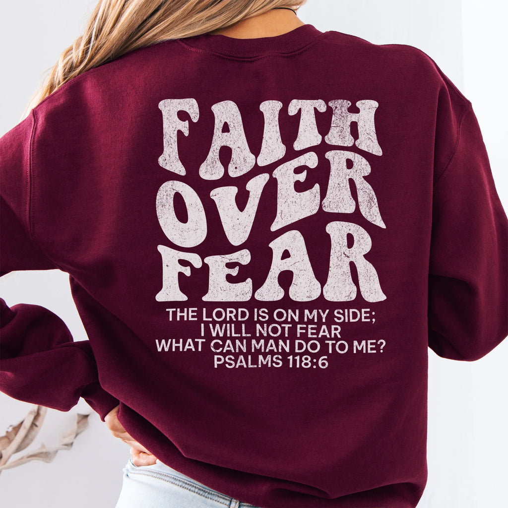 Maroon Oakley June sweatshirt, large back lettering reads Faith Over Fear with supporting scripture lines, studio back view