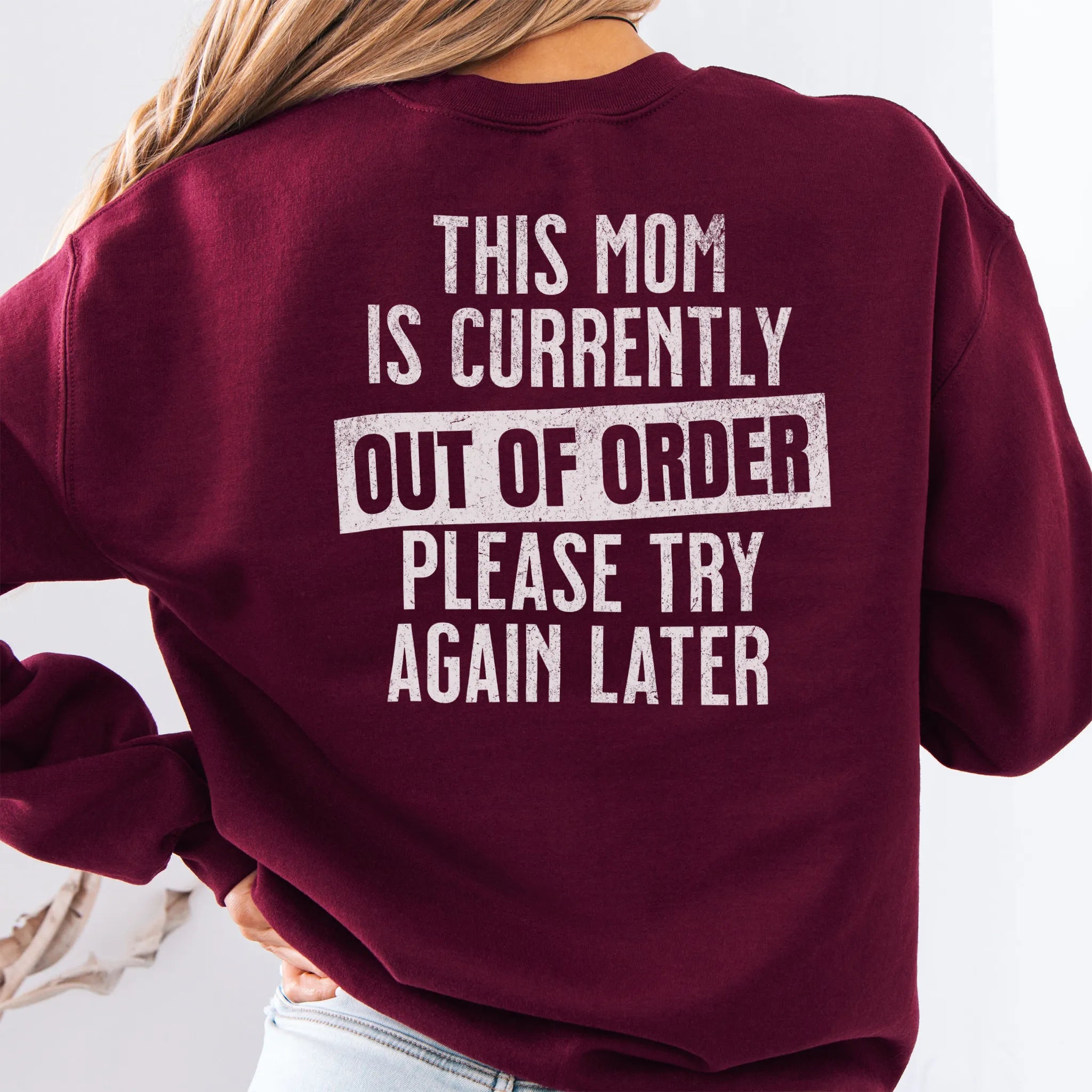 Maroon sweatshirt – large back text “This Mom Is Currently Out of Order, Please Try Again Later”, relaxed modern fit, studio back view
