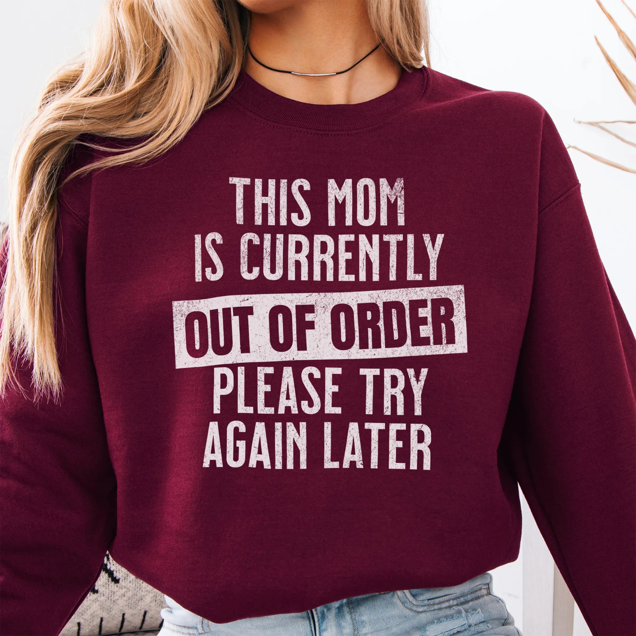 Maroon sweatshirt – large front text reads “This Mom Is Currently Out of Order, Please Try Again Later”, relaxed modern fit, cropped to torso, studio front view