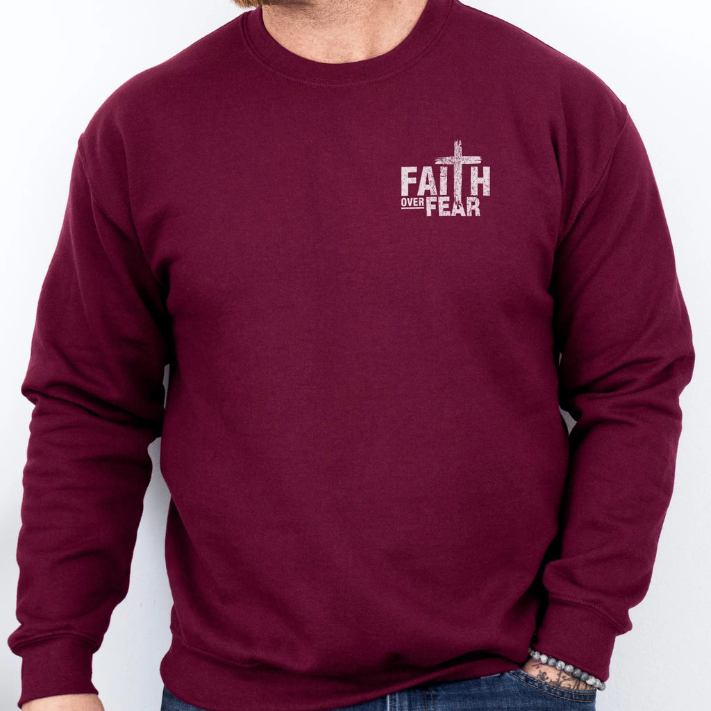 Maroon Oakley June sweatshirt, mens fit, left chest badge reads Faith Over Fear with cross, studio front view