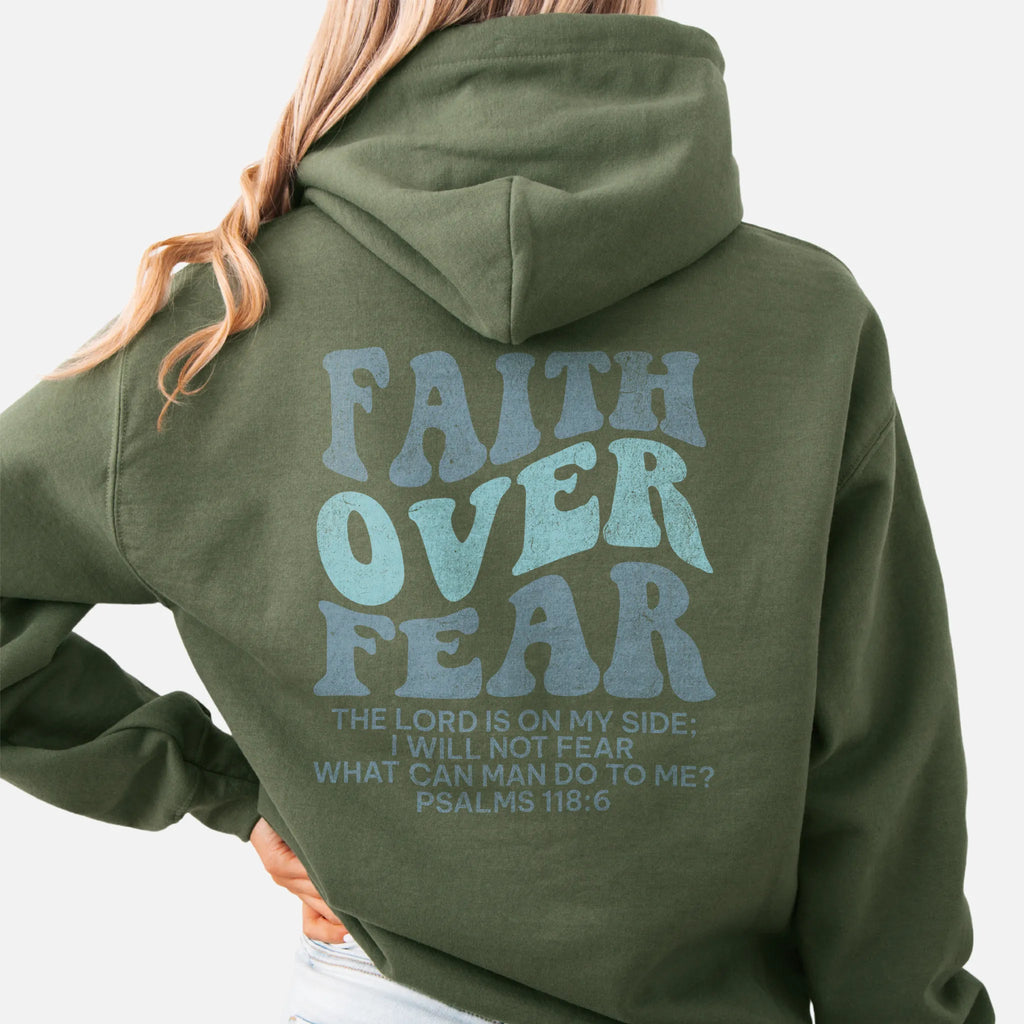 Military Green Oakley June hoodie, large back lettering reads Faith Over Fear with supporting scripture lines, hood up, studio back view