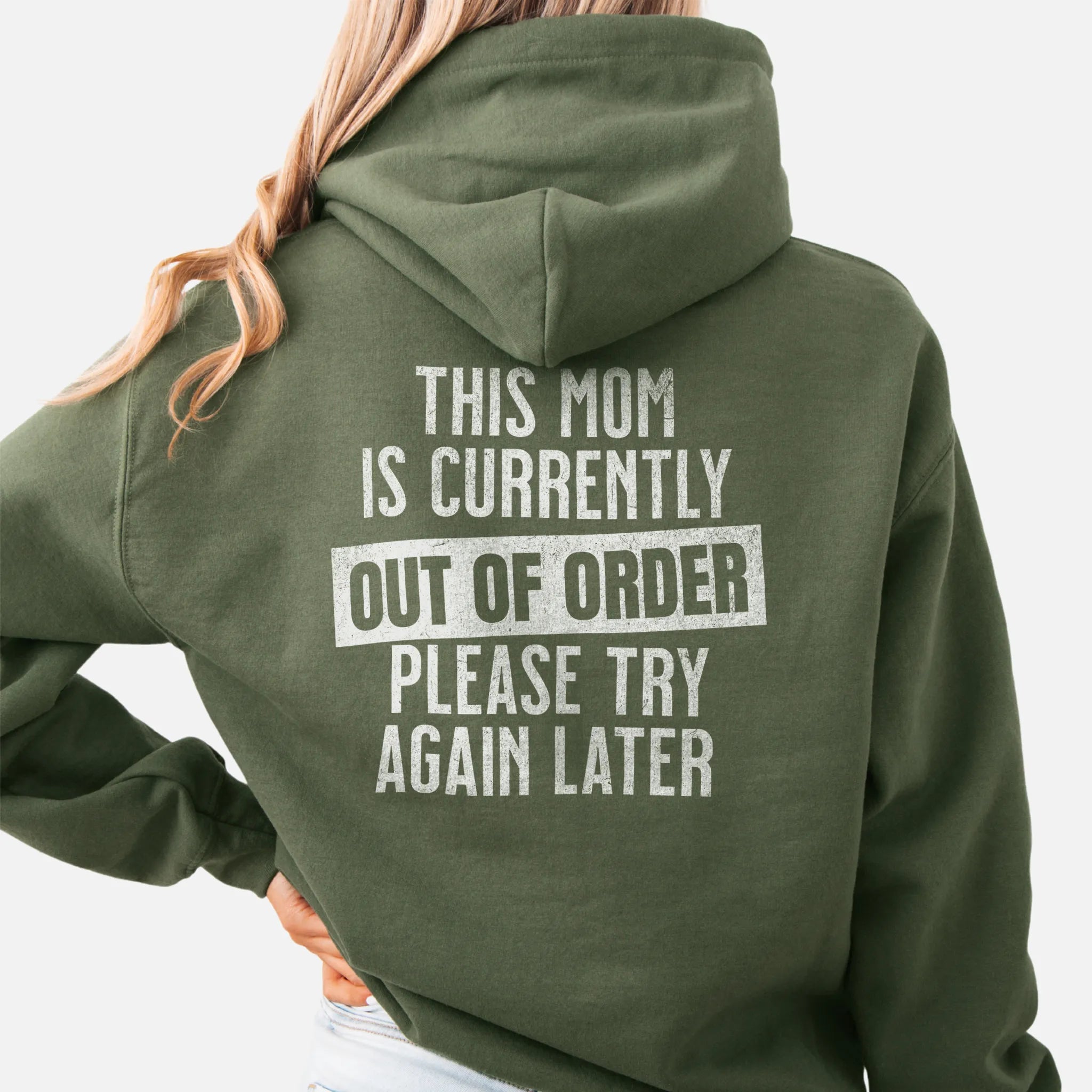 Military Green hoodie – large back text reads “This Mom Is Currently Out of Order, Please Try Again Later”, relaxed modern fit with hood up, studio back view