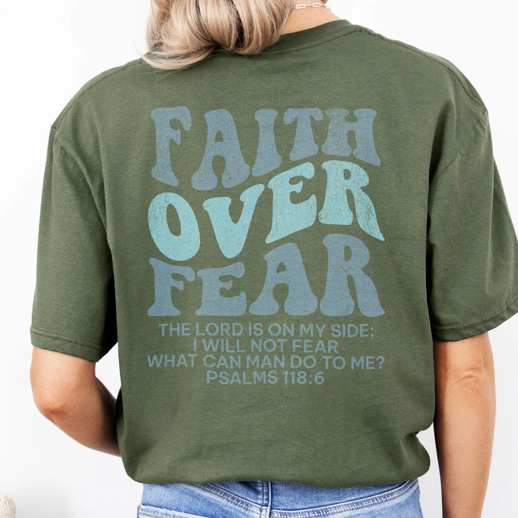 Military Green Oakley June t shirt, large back lettering reads Faith Over Fear with supporting scripture lines, studio back view