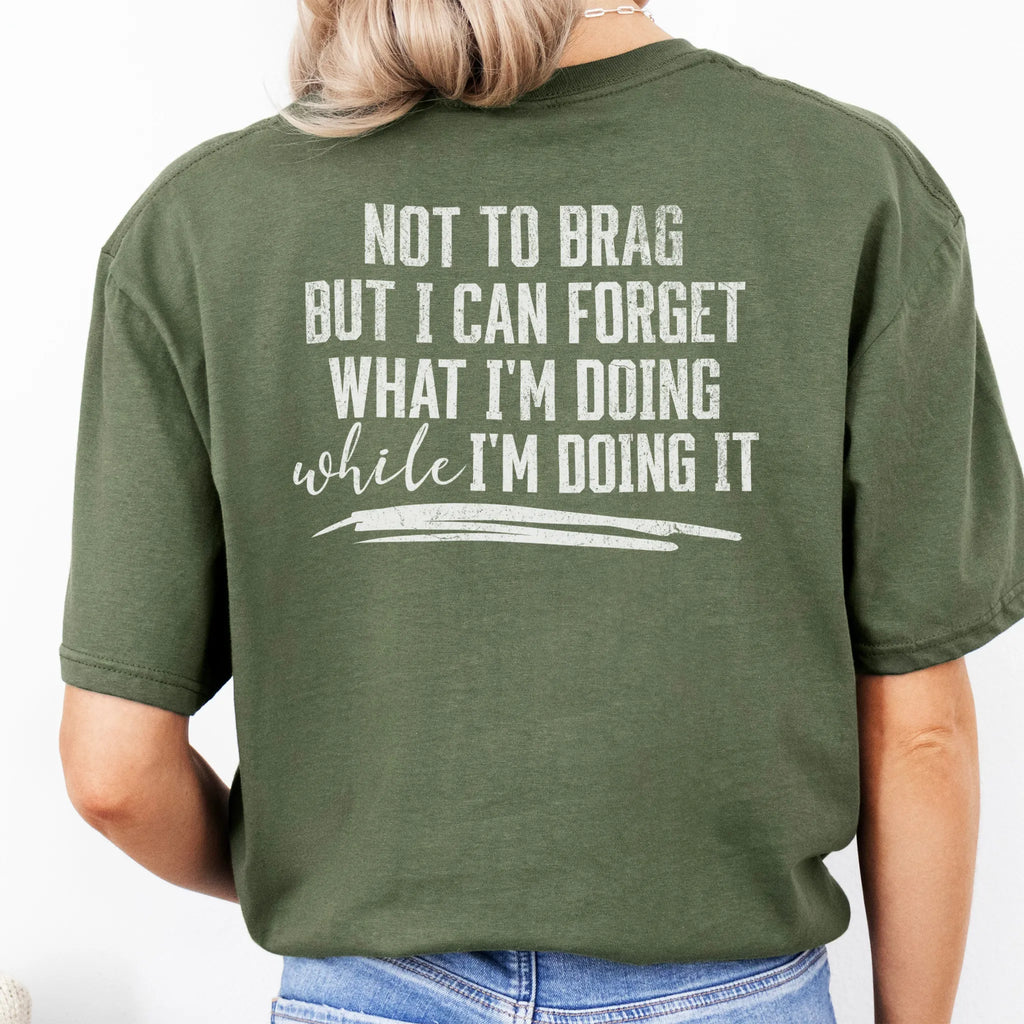 Military Green Oakley June T Shirt back view large text Not To Brag But I Can Forget What I’m Doing While I’m Doing It underline distressed print