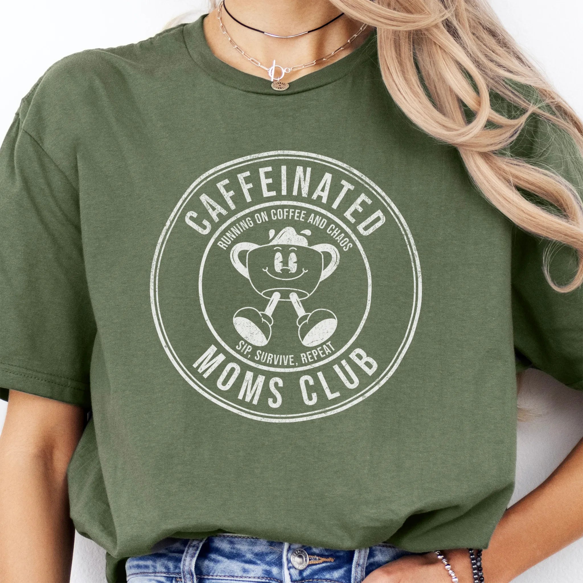 Military Green Oakley June T Shirt front view large Caffeinated Moms Club circle badge coffee cup mascot text Running on Coffee and Chaos Sip Survive Repeat distressed