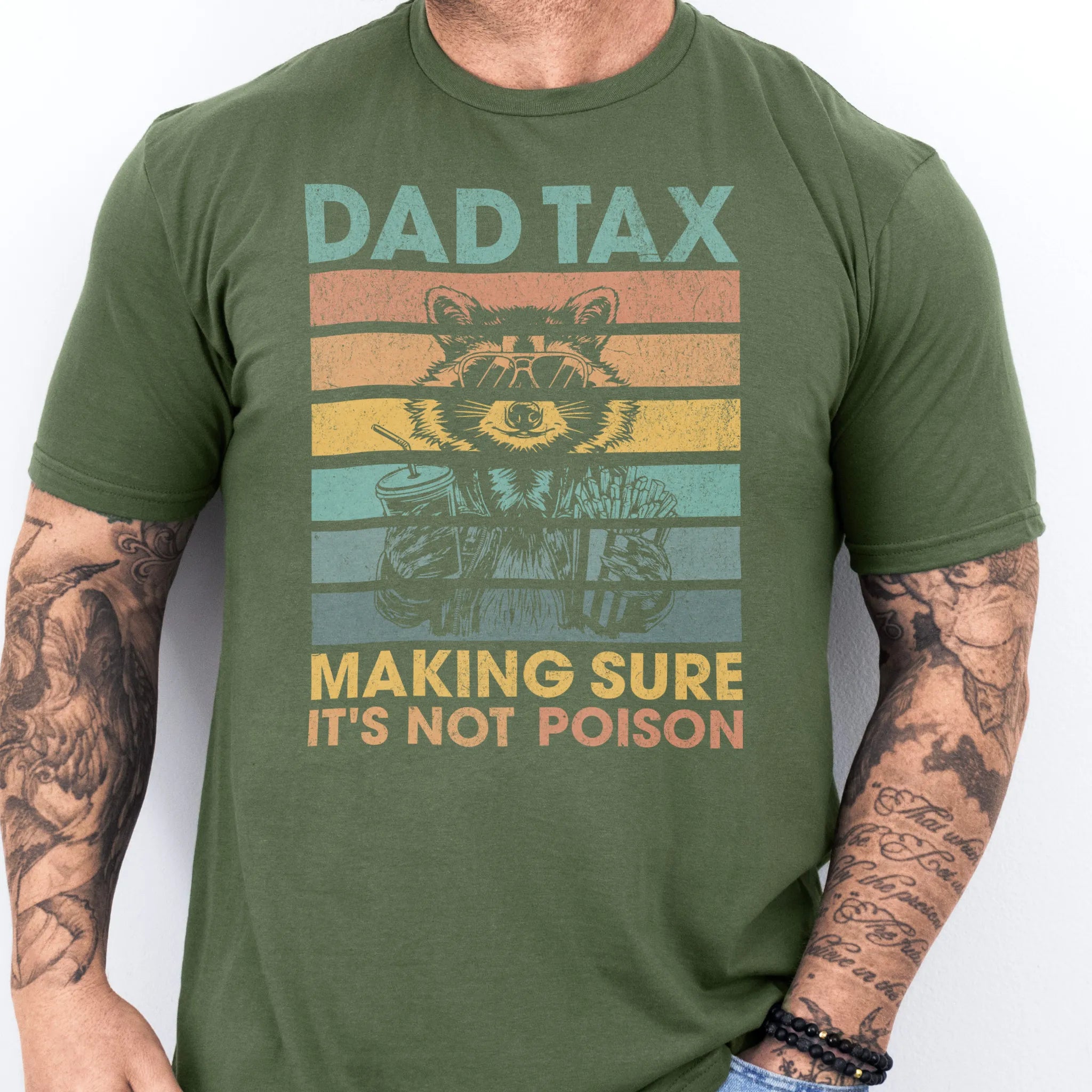 Military Green Oakley June T Shirt front view Dad Tax retro stripes raccoon wearing sunglasses holding soda and fries text Making Sure It’s Not Poison distressed print