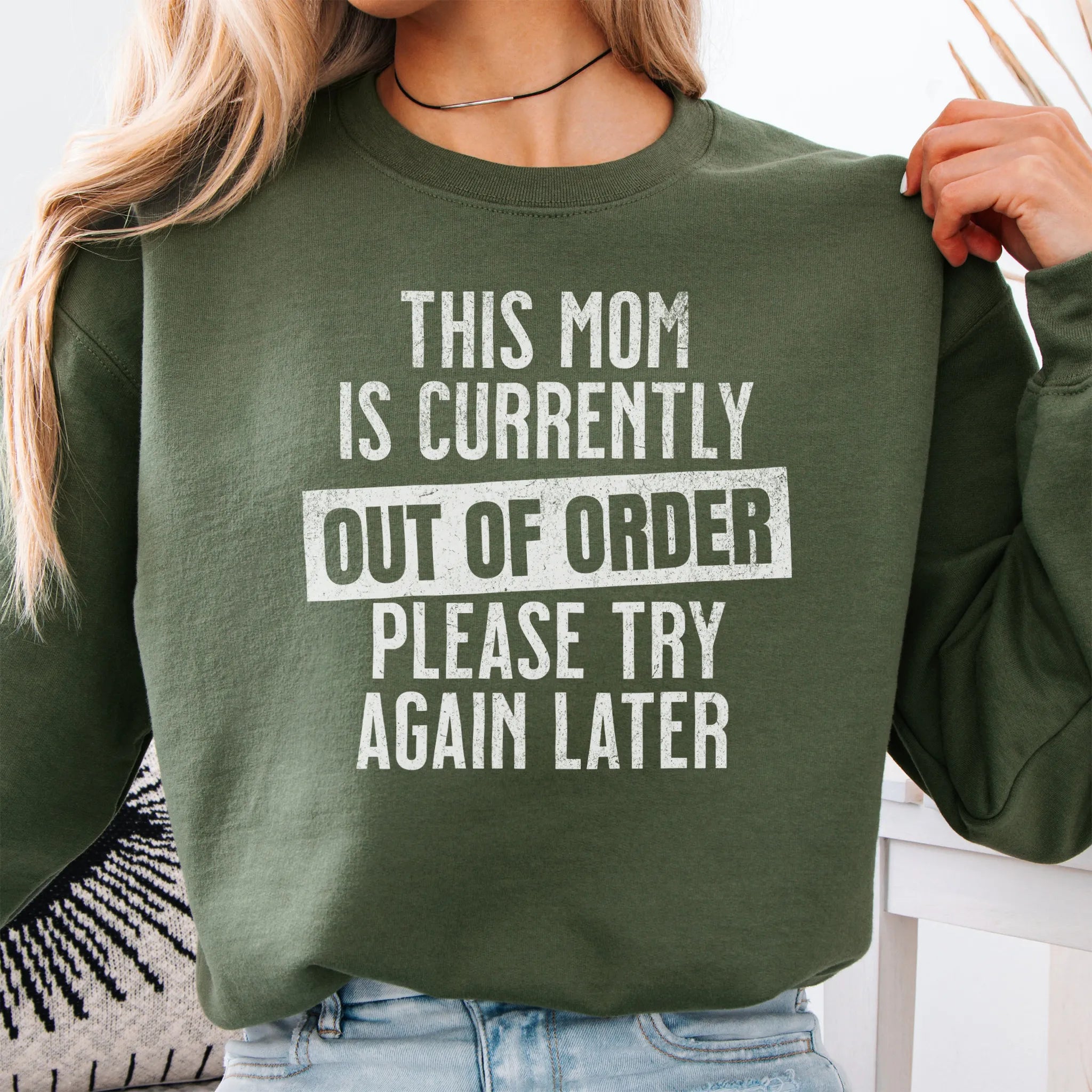 Military Green sweatshirt – large front text reads “This Mom Is Currently Out of Order, Please Try Again Later”, relaxed modern fit, cropped to torso, studio front view