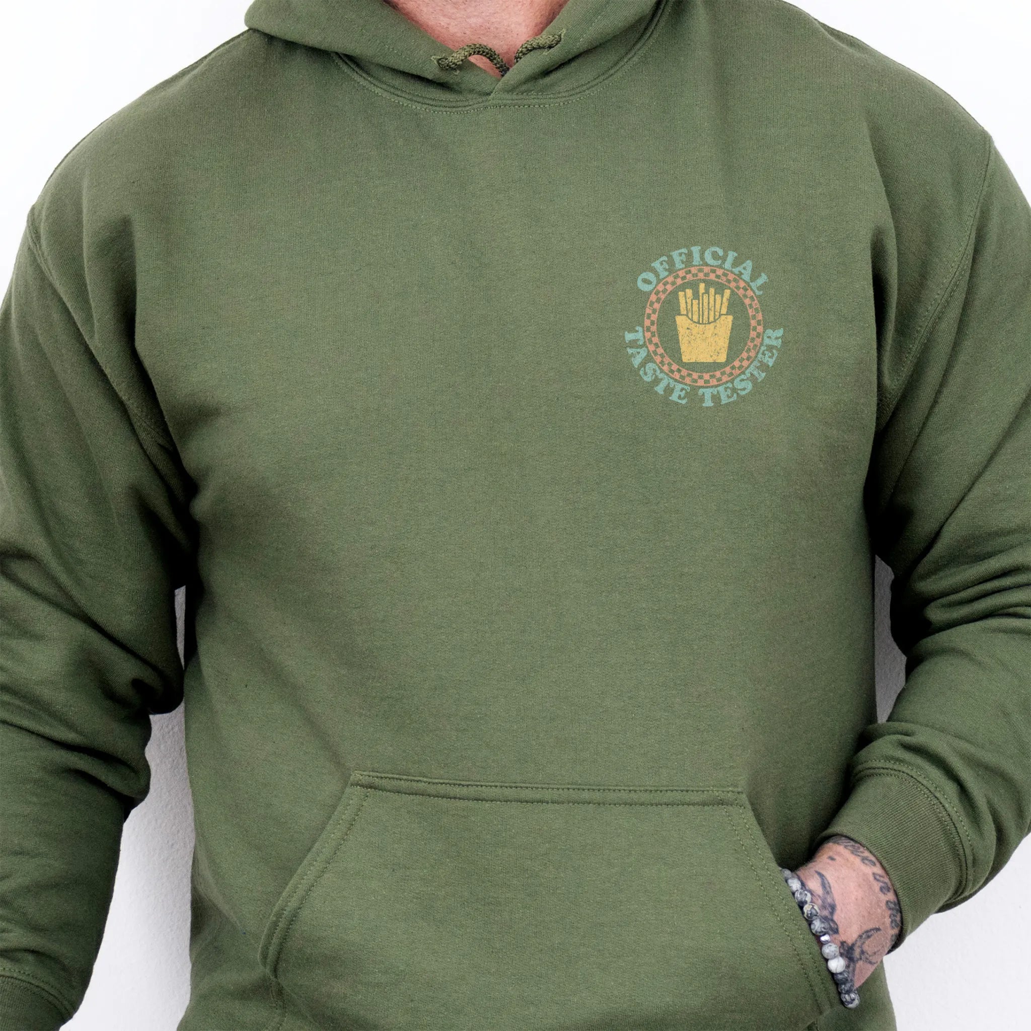Military Green Oakley June Hoodie front view Dad Tax Official Taste Tester left chest badge retro circle fries emblem kangaroo pocket drawstrings visible
