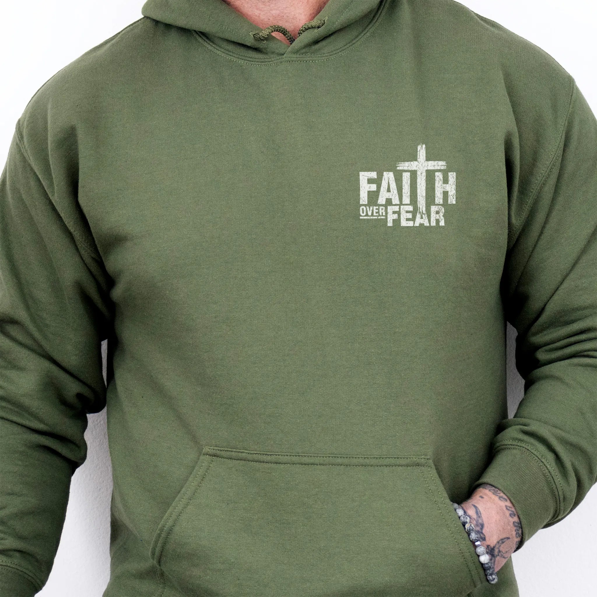 Military Green Oakley June hoodie, mens fit, left chest badge reads Faith Over Fear with cross, kangaroo pocket, studio front view