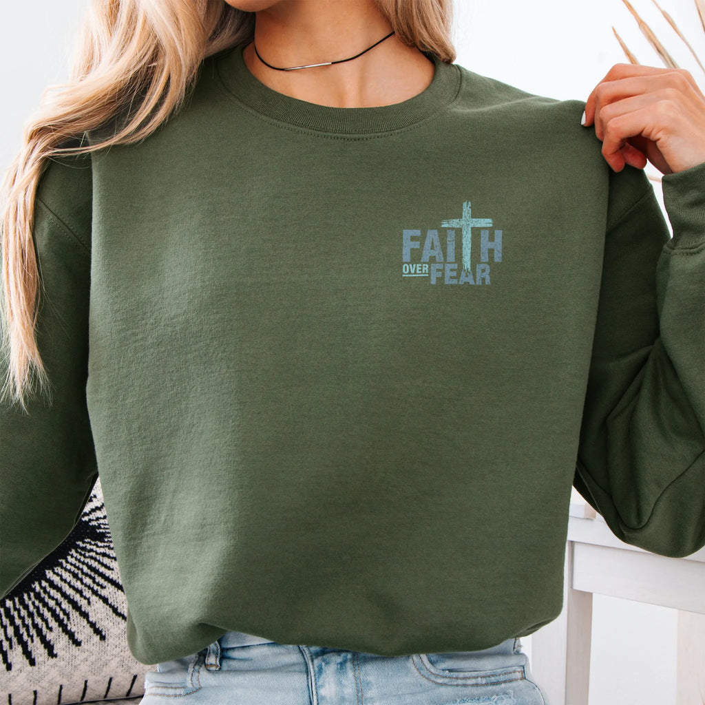 Military Green Oakley June sweatshirt, left chest badge reads Faith Over Fear with small cross, relaxed modern fit, studio front view