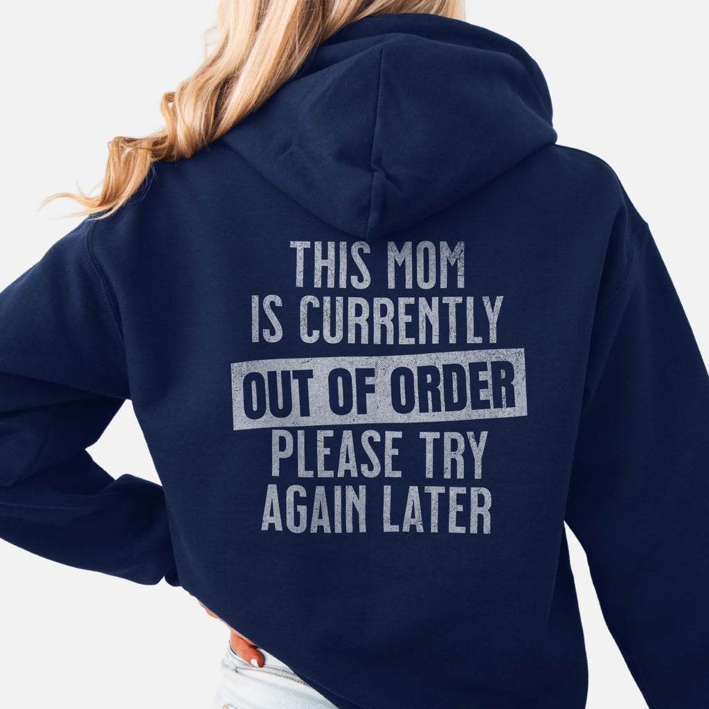 Navy hoodie – large back text reads “This Mom Is Currently Out of Order, Please Try Again Later”, relaxed modern fit with hood up, studio back view