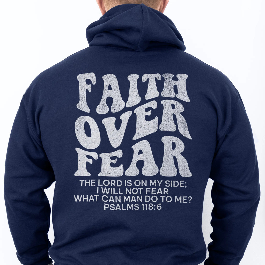 Navy Oakley June hoodie, mens fit, large back lettering reads Faith Over Fear with supporting scripture lines, studio back view