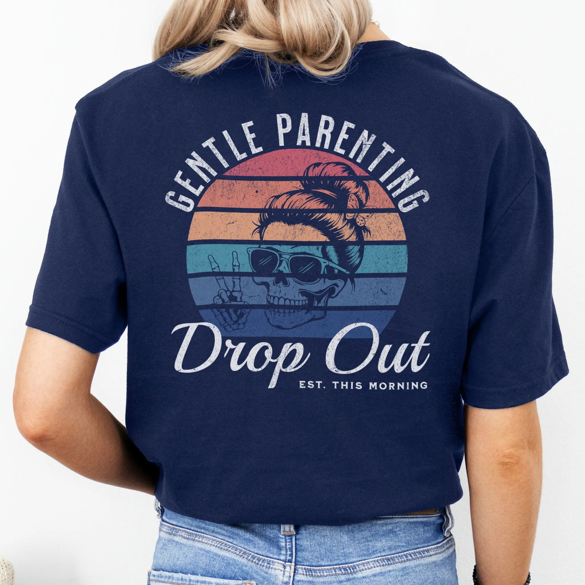 Navy Oakley June T Shirt back view Gentle Parenting Drop Out large round retro badge skull with messy bun wearing sunglasses peace sign script Est This Morning distressed print