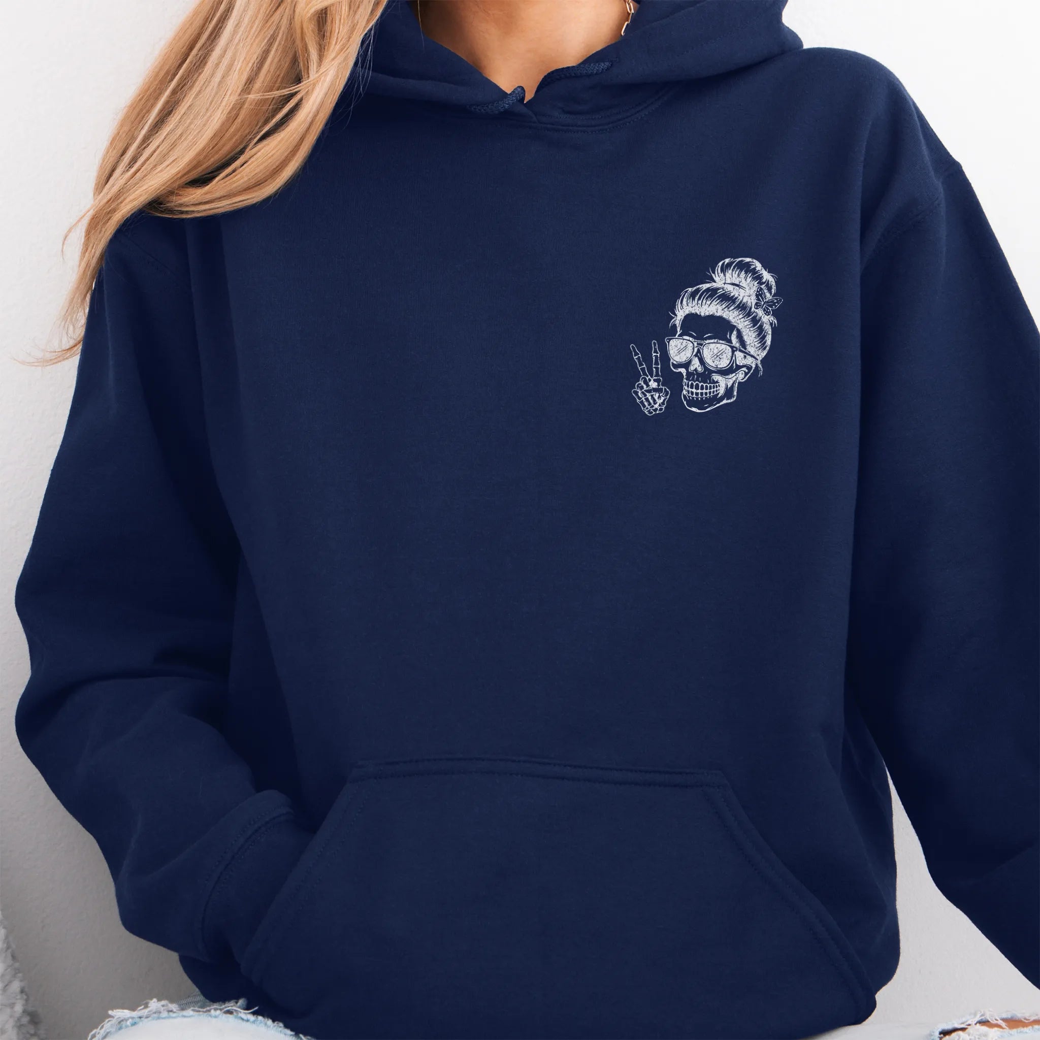 Navy Oakley June Hoodie front view small left chest skull with messy bun peace sign minimalist mark kangaroo pocket drawstrings visible distressed print