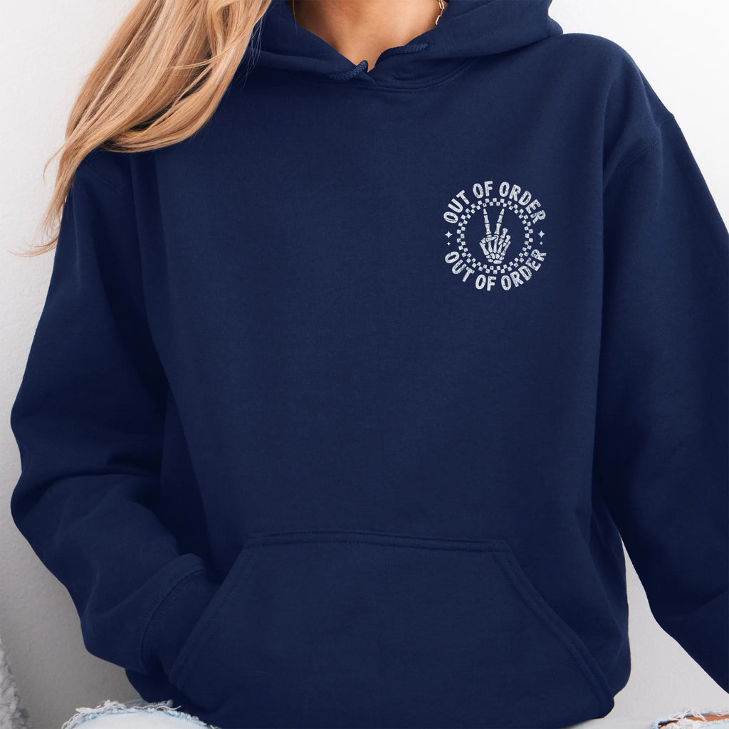 Navy hoodie – left chest circular badge with “Out of Order” text, kangaroo pocket and relaxed modern fit, studio front view