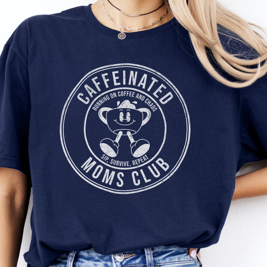 Navy Oakley June T Shirt front view large Caffeinated Moms Club circle badge coffee cup mascot text Running on Coffee and Chaos Sip Survive Repeat distressed