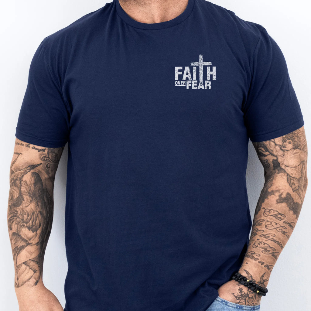 Navy Oakley June t shirt, mens fit, left chest badge reads Faith Over Fear with cross, studio front view