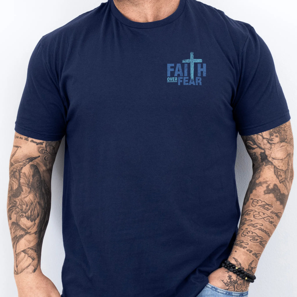 Navy Oakley June t shirt, mens fit, left chest badge reads Faith Over Fear with small cross, studio front view