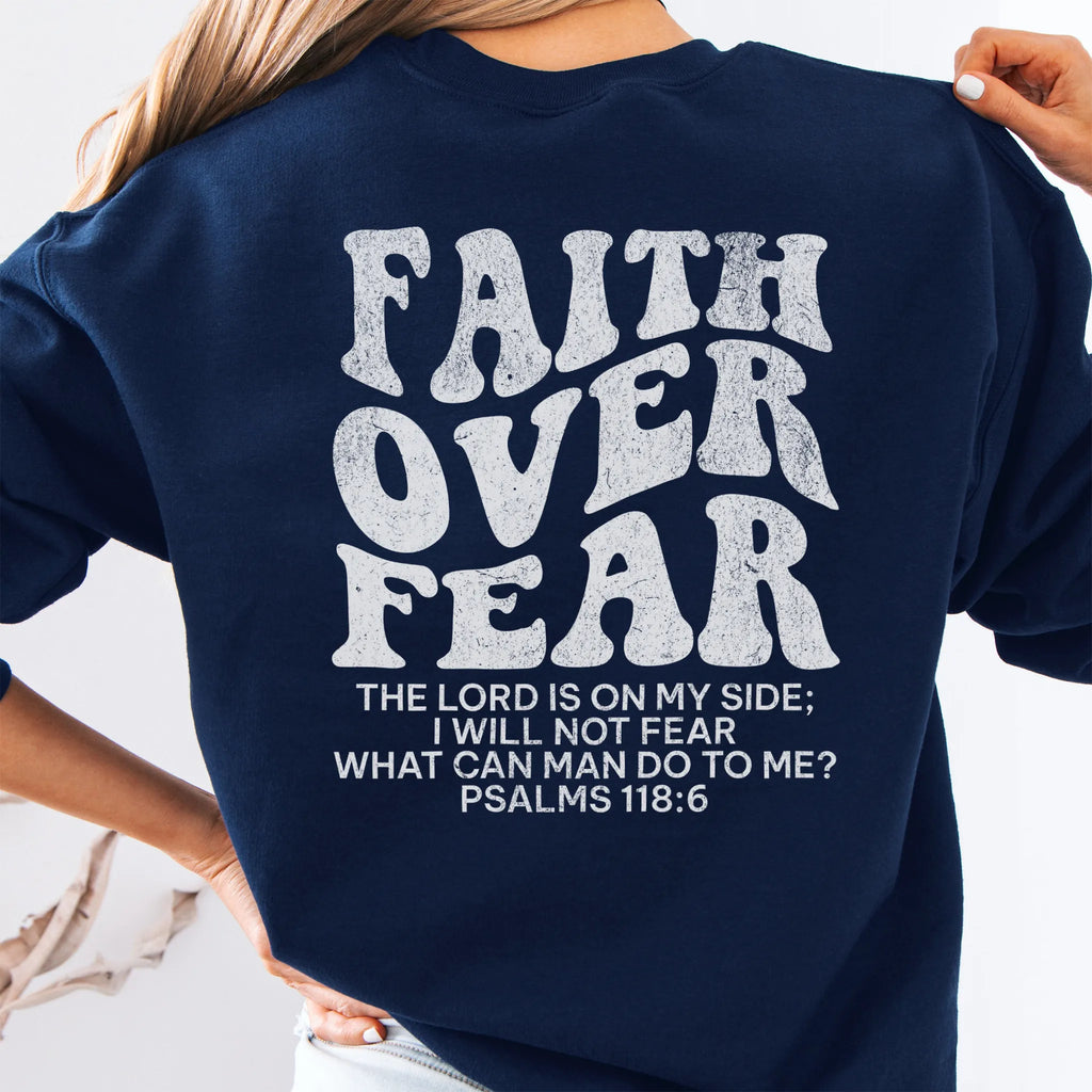 Navy Oakley June sweatshirt, large back lettering reads Faith Over Fear with supporting scripture lines, studio back view