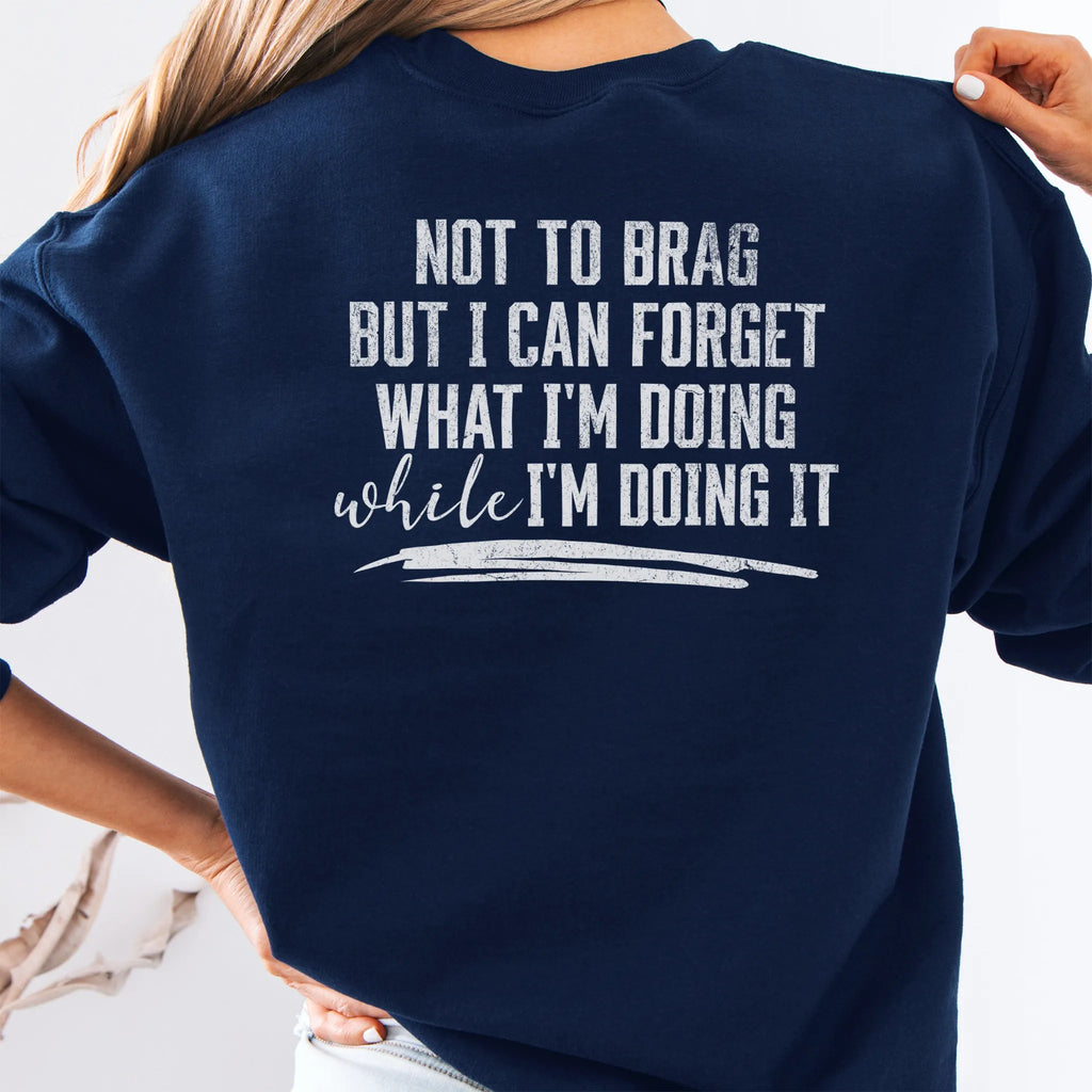 Navy Oakley June Sweatshirt back view large text Not To Brag But I Can Forget What I’m Doing While I’m Doing It underline distressed print