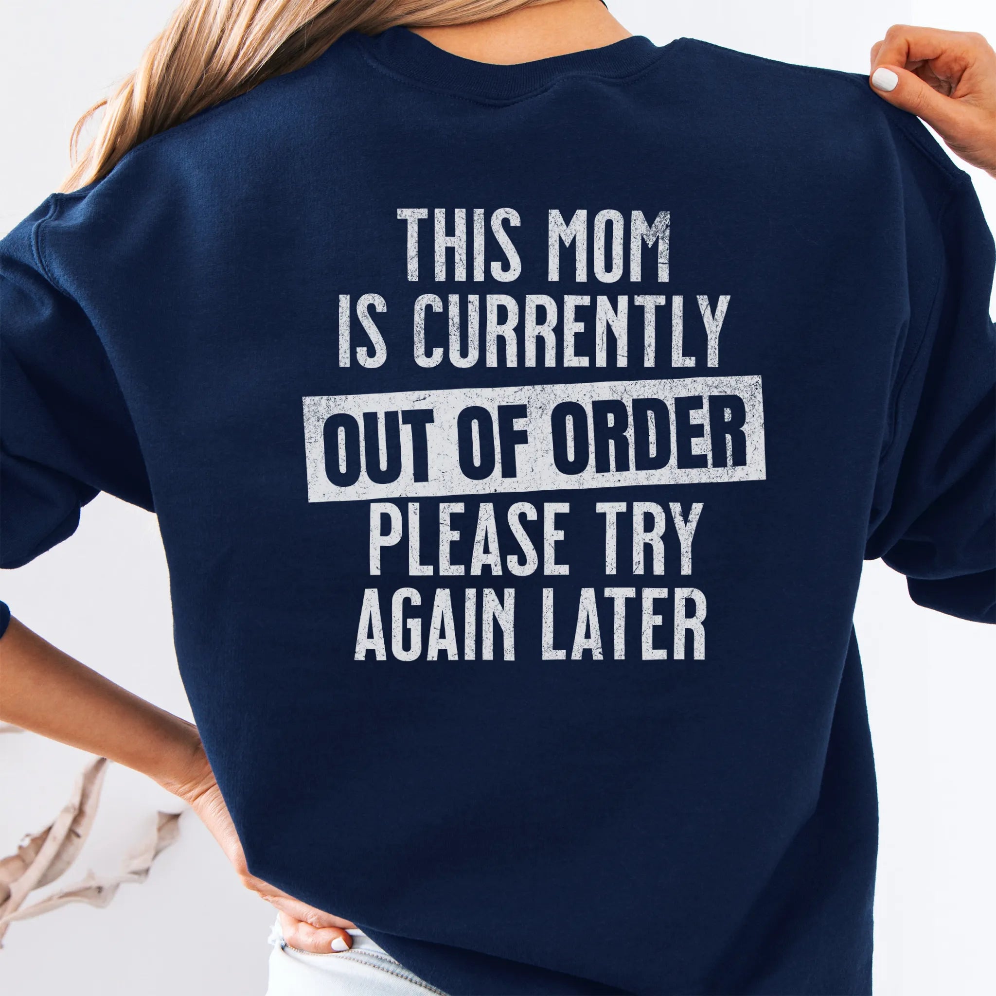 Navy sweatshirt – large back text “This Mom Is Currently Out of Order, Please Try Again Later”, relaxed modern fit, studio back view