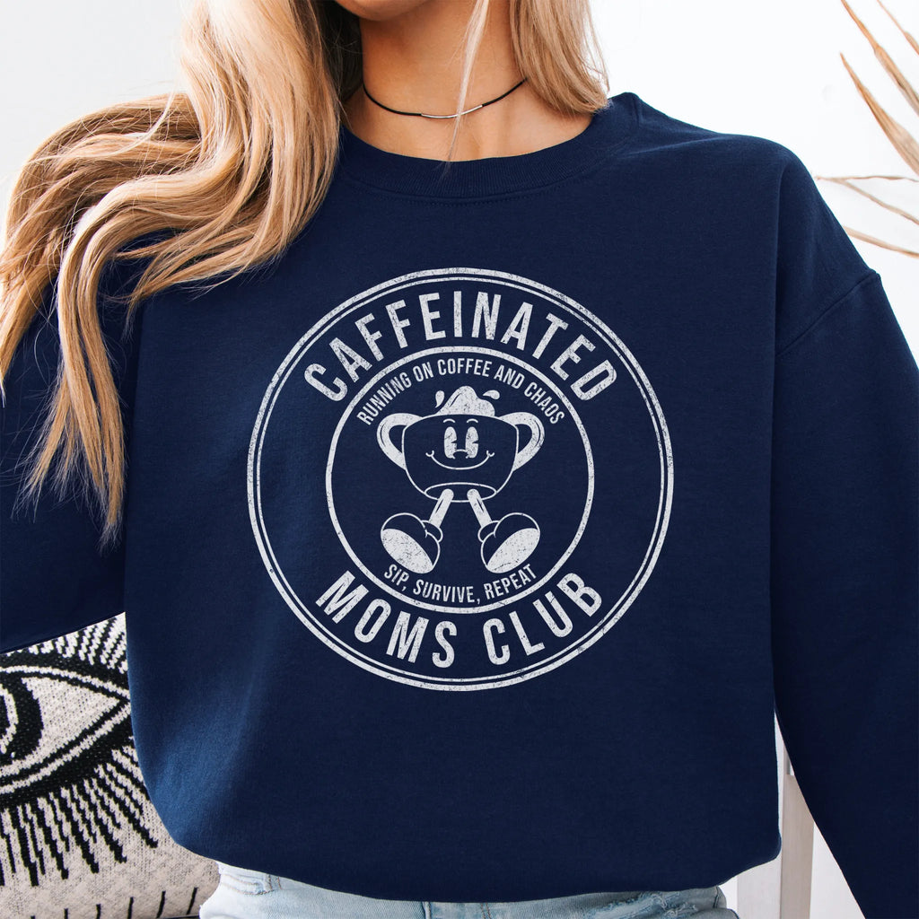 Navy Oakley June Sweatshirt front view large Caffeinated Moms Club circle badge coffee cup mascot text Running on Coffee and Chaos Sip Survive Repeat mono black ink distressed