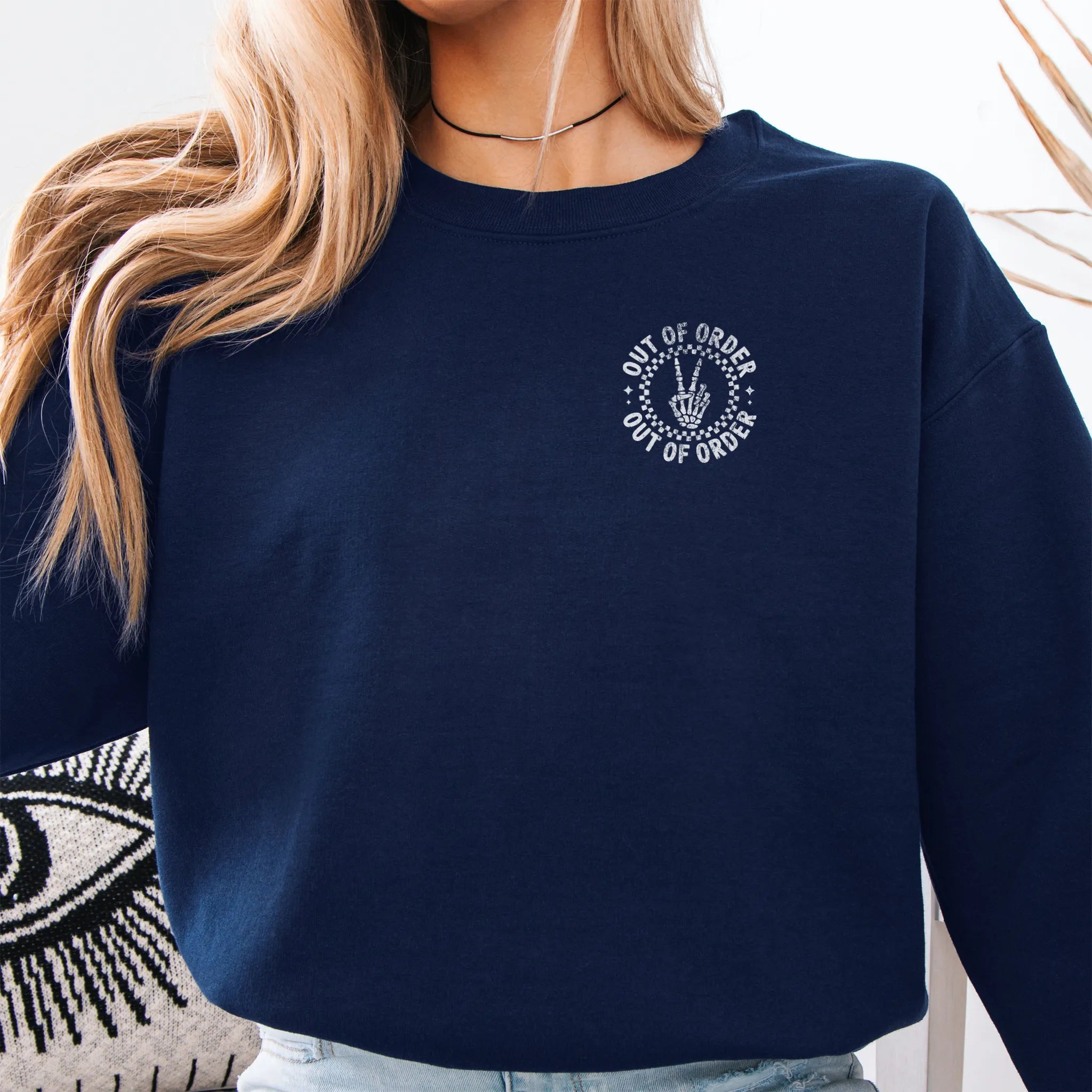 Navy sweatshirt – left chest “Out of Order” circular badge, relaxed modern fit, cropped to torso, studio front view