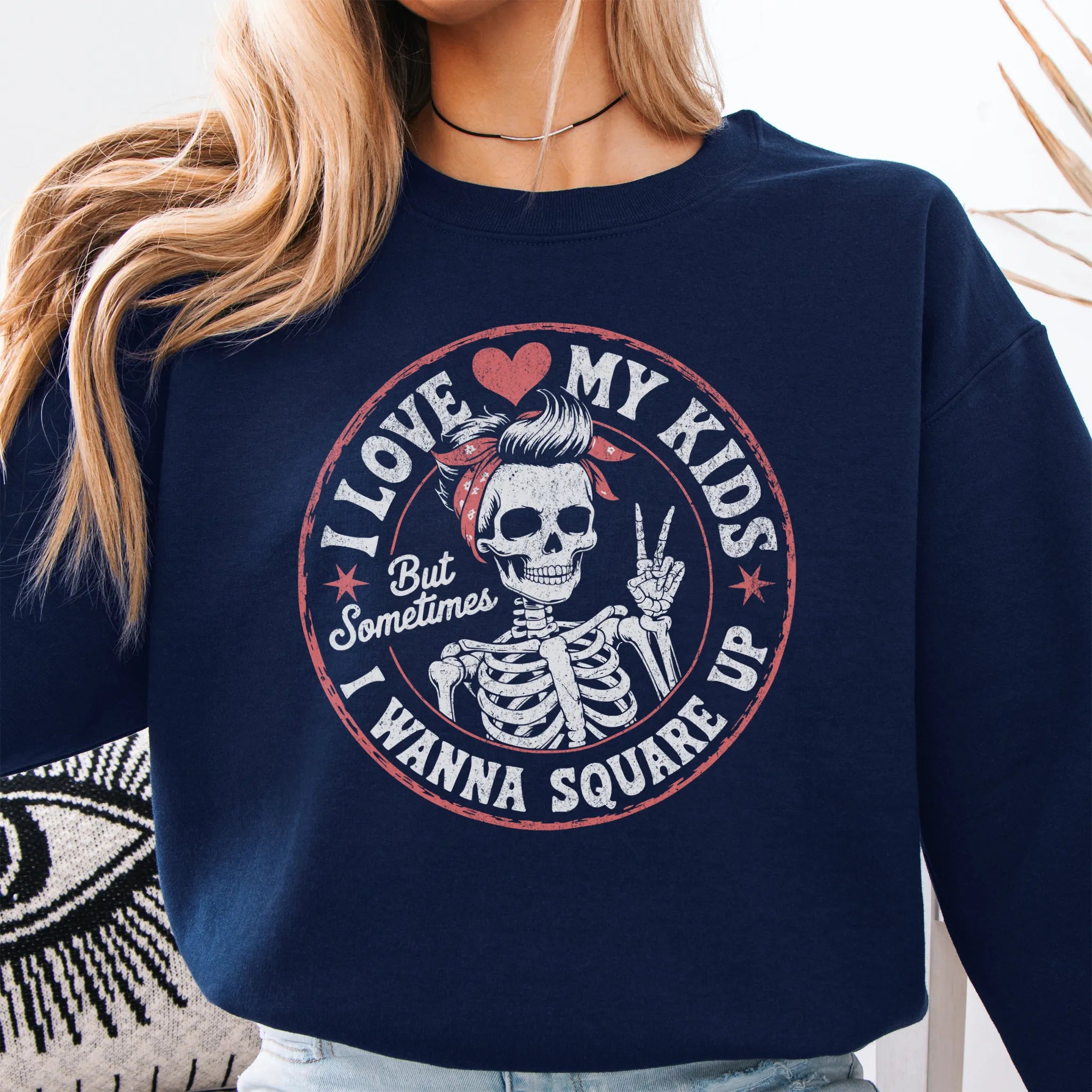 Navy sweatshirt – large front circle graphic with skeleton mom giving a peace sign, headline reads “I Love My Kids But Sometimes I Wanna Square Up”, studio front view