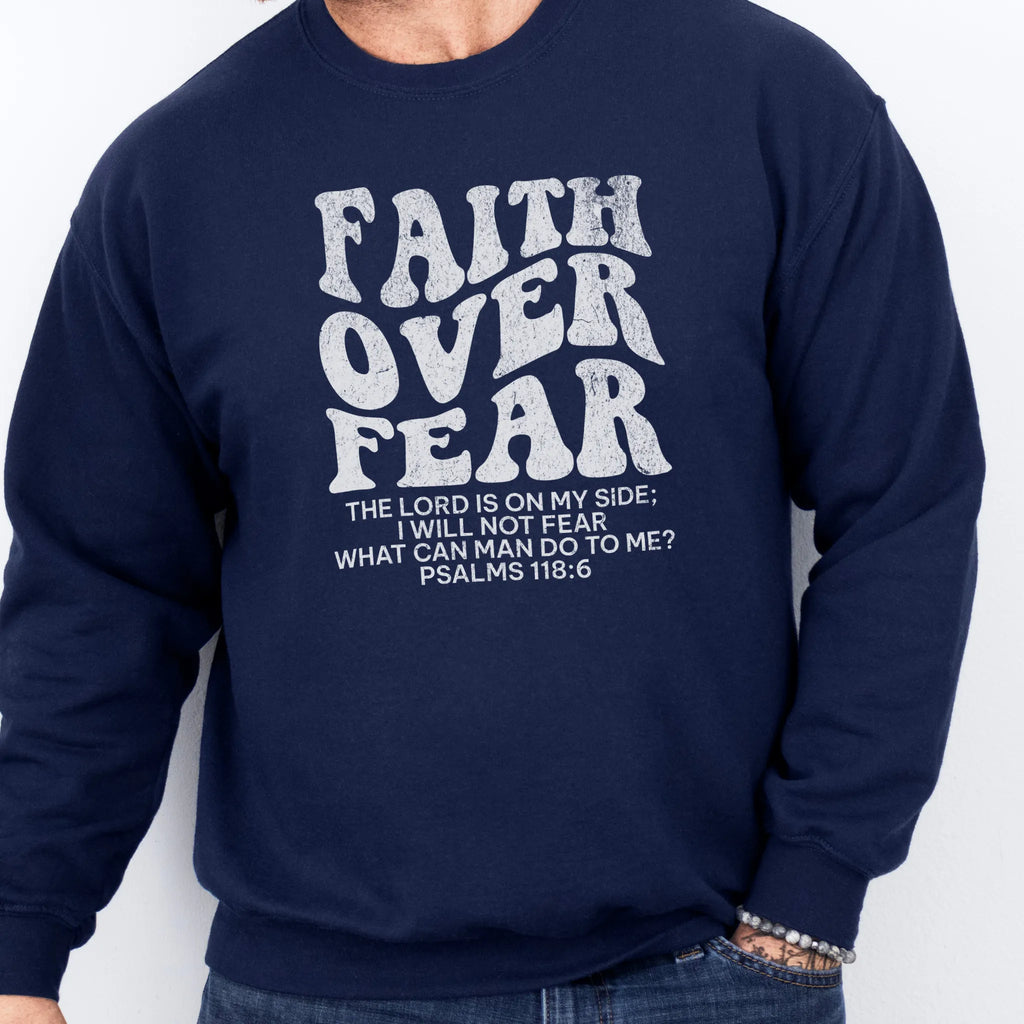 Navy Oakley June sweatshirt, mens fit, left chest badge reads Faith Over Fear with cross, studio front view
