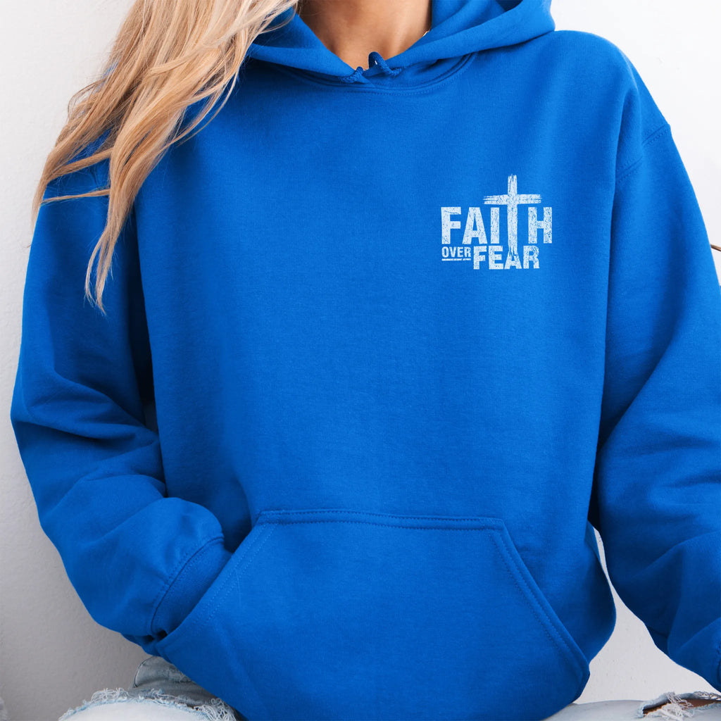Royal Oakley June hoodie, left chest badge reads Faith Over Fear with small cross, kangaroo pocket and relaxed modern fit, studio front view