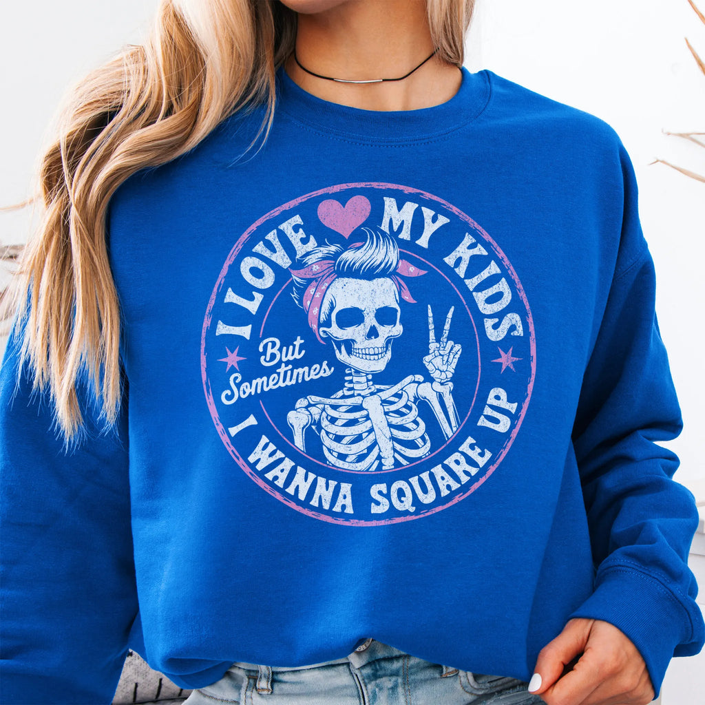 Royal sweatshirt – large front circle graphic with skeleton mom giving a peace sign, headline reads “I Love My Kids But Sometimes I Wanna Square Up”, studio front view