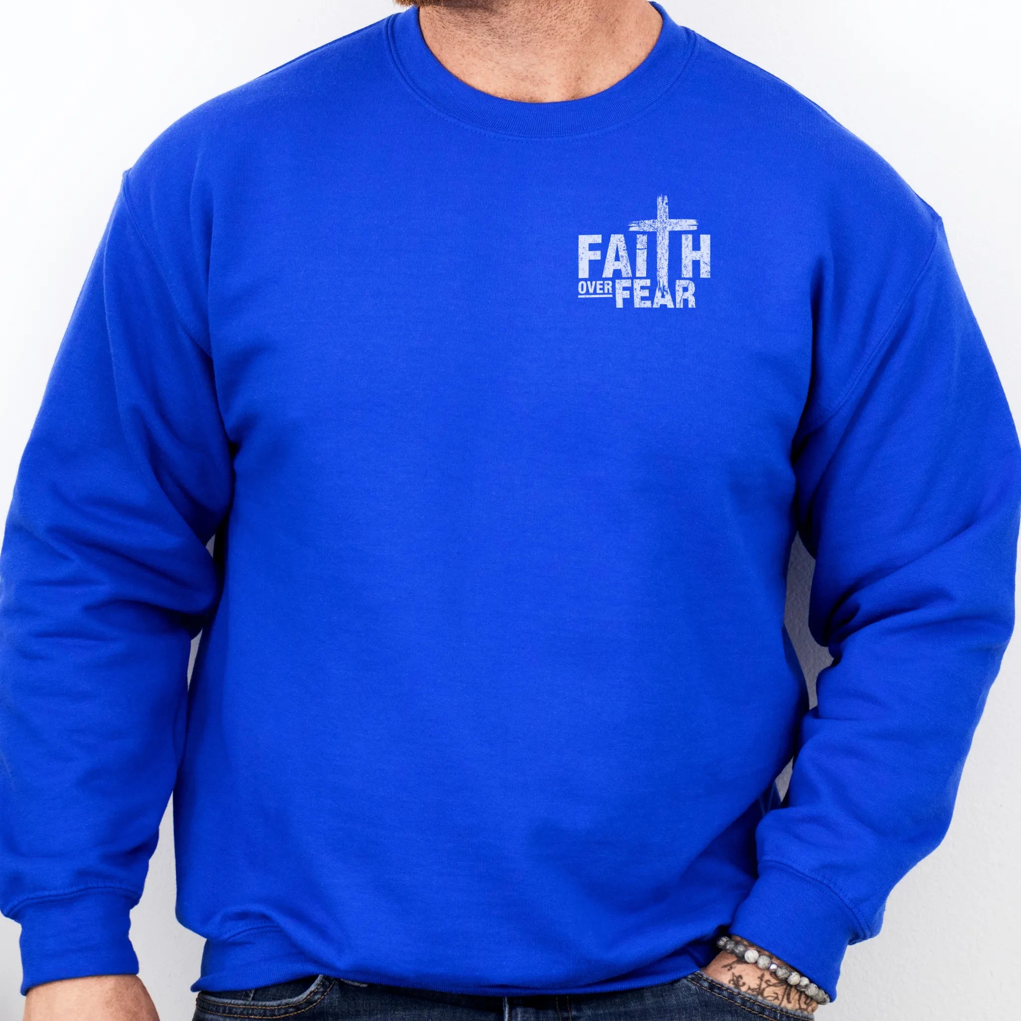 Royal Oakley June sweatshirt, mens fit, left chest badge reads Faith Over Fear with cross, studio front view