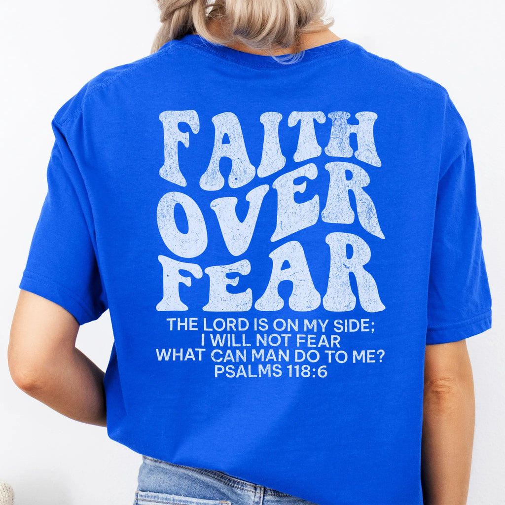 Royal Oakley June t shirt, large back lettering reads Faith Over Fear with supporting scripture reference Psalms one eighteen six, studio back view