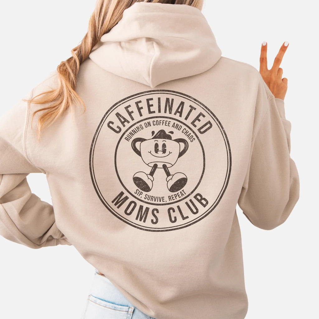 Sand Oakley June Hoodie back view Caffeinated Moms Club large circle badge coffee cup mascot text Running on Coffee and Chaos Sip Survive Repeat distressed print