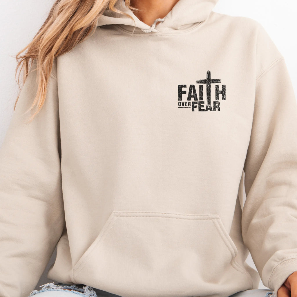 Sand Oakley June hoodie, left chest badge reads Faith Over Fear with small cross, kangaroo pocket and relaxed modern fit, studio front view
