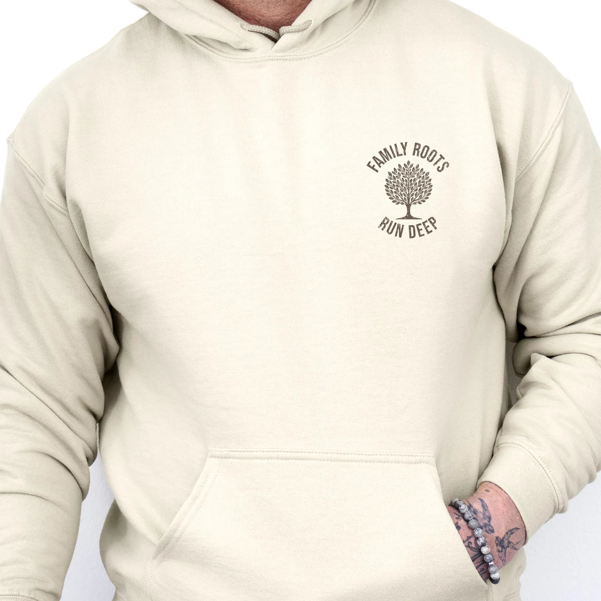 Sand Oakley June Hoodie – left chest tree badge with text Family Roots Run Deep, cozy unisex pullover