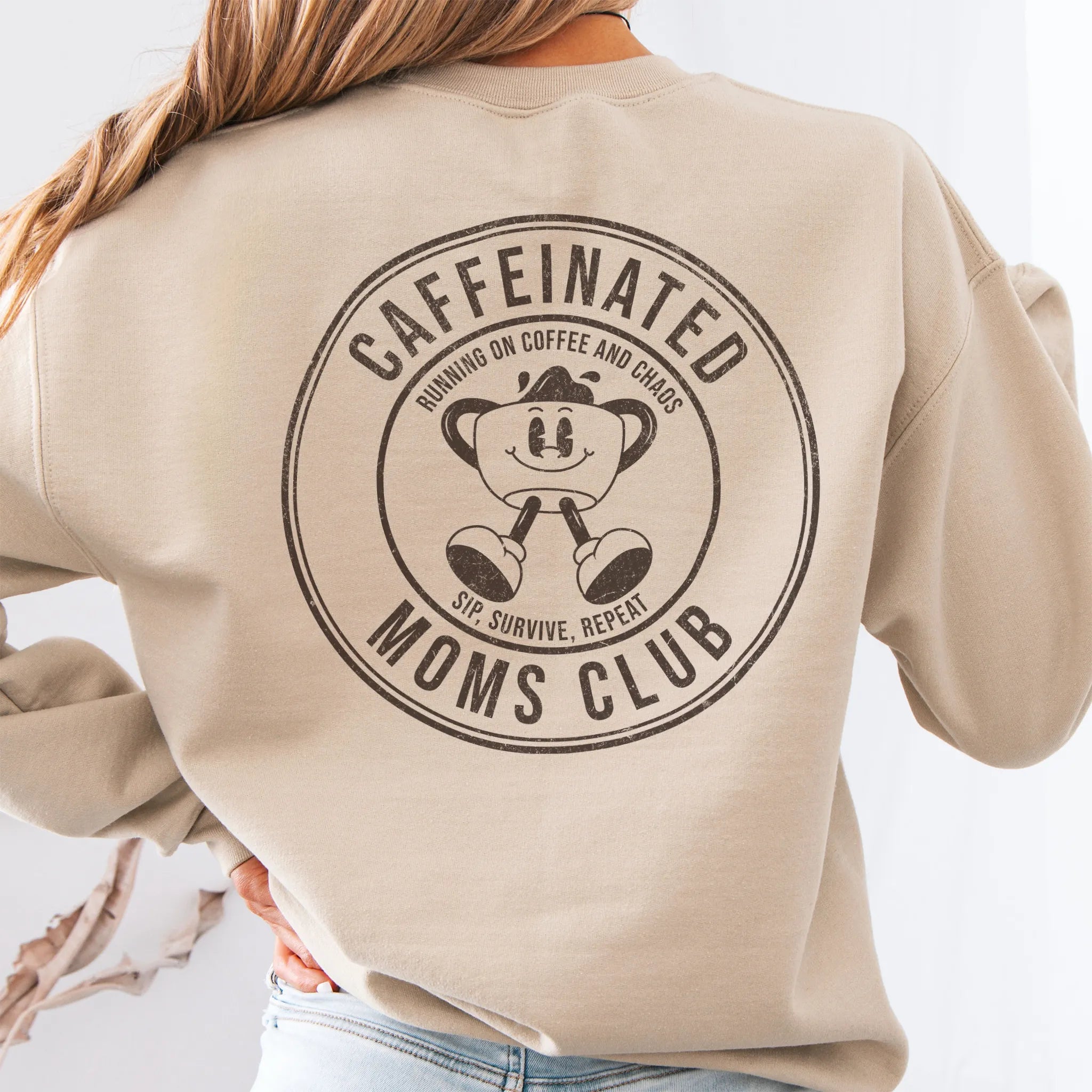 Sand Oakley June Sweatshirt front view small left chest coffee cup mascot Caffeinated Moms Club minimal distressed