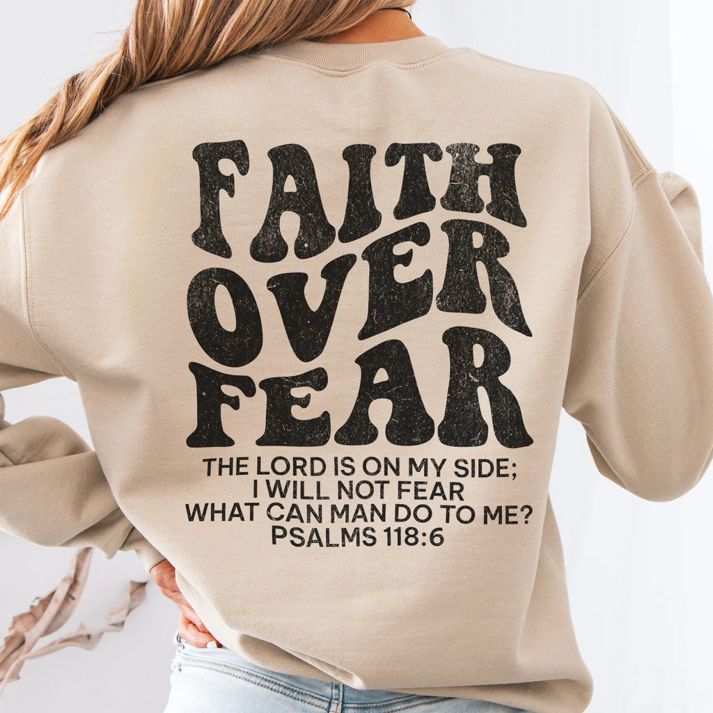 Sand Oakley June sweatshirt, large back lettering reads Faith Over Fear with supporting scripture lines, studio back view