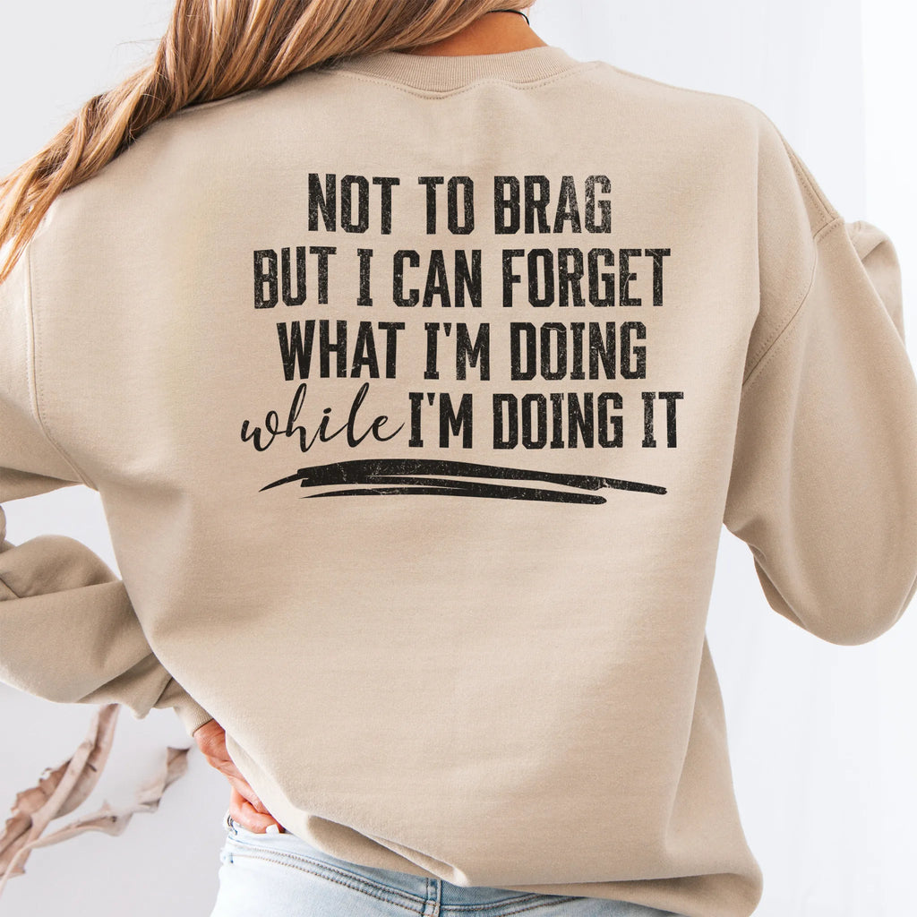 Sand Oakley June Sweatshirt back view large text Not To Brag But I Can Forget What I’m Doing While I’m Doing It underline distressed print