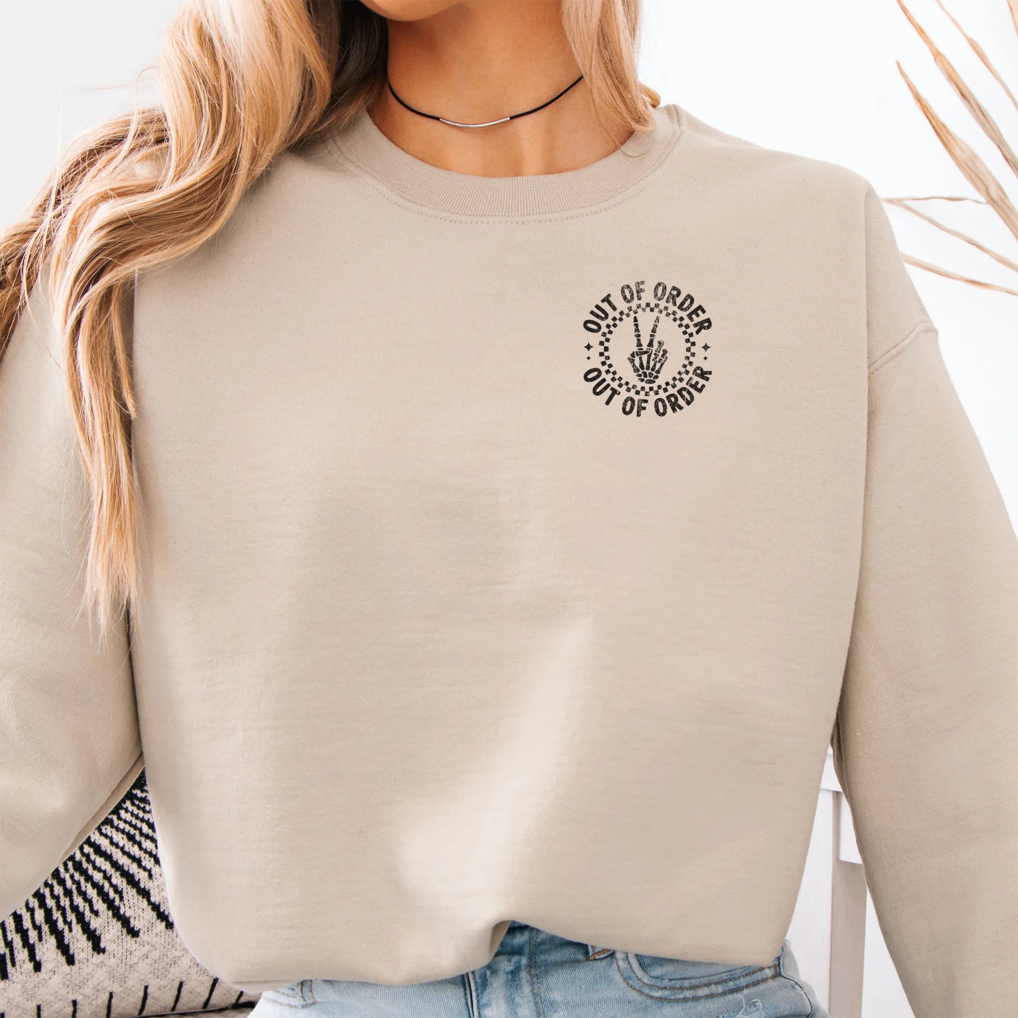 Sand sweatshirt – left chest “Out of Order” circular badge, relaxed modern fit, cropped to torso, studio front view