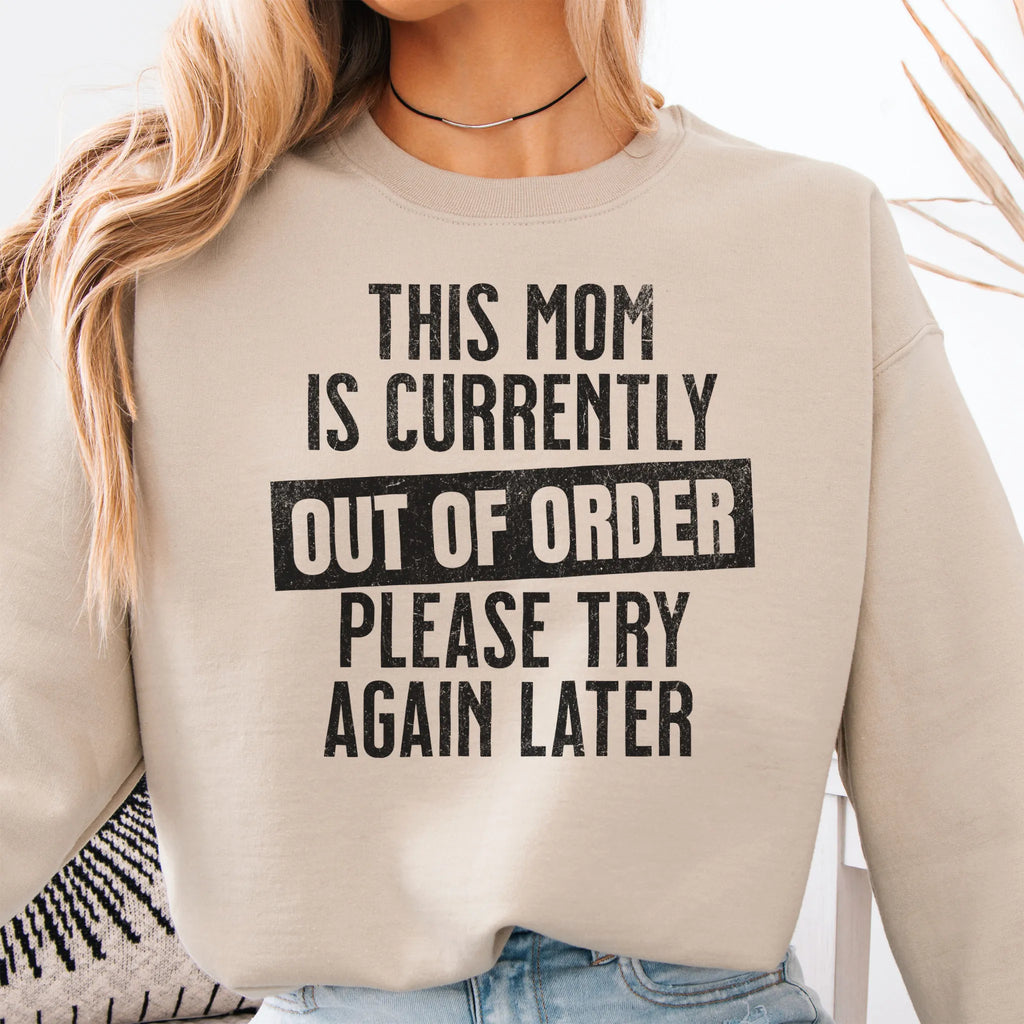 Sand sweatshirt – large front text reads “This Mom Is Currently Out of Order, Please Try Again Later”, relaxed modern fit, cropped to torso, studio front view