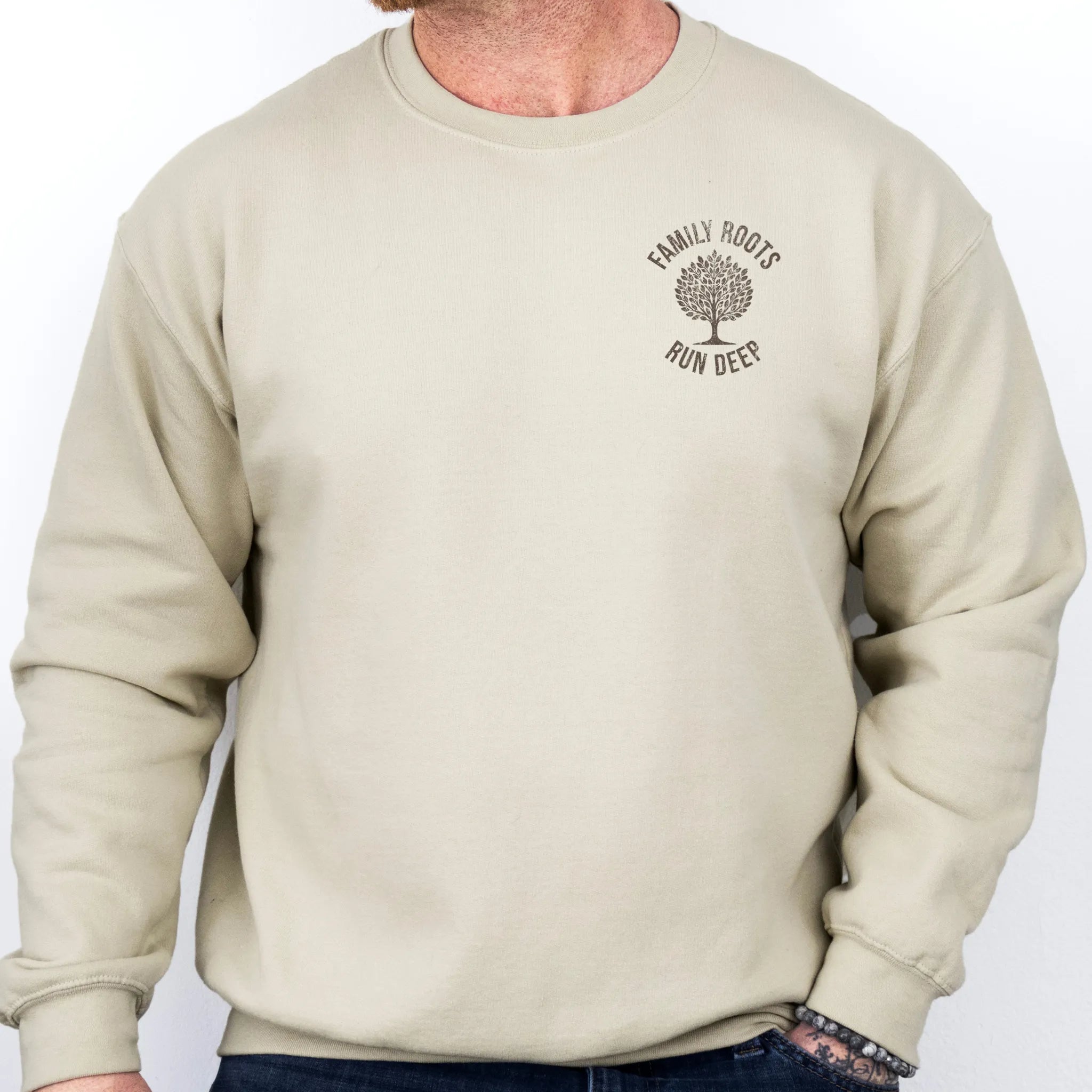 Sand Oakley June Sweatshirt – left chest tree badge with text Family Roots Run Deep, cozy unisex crewneck
